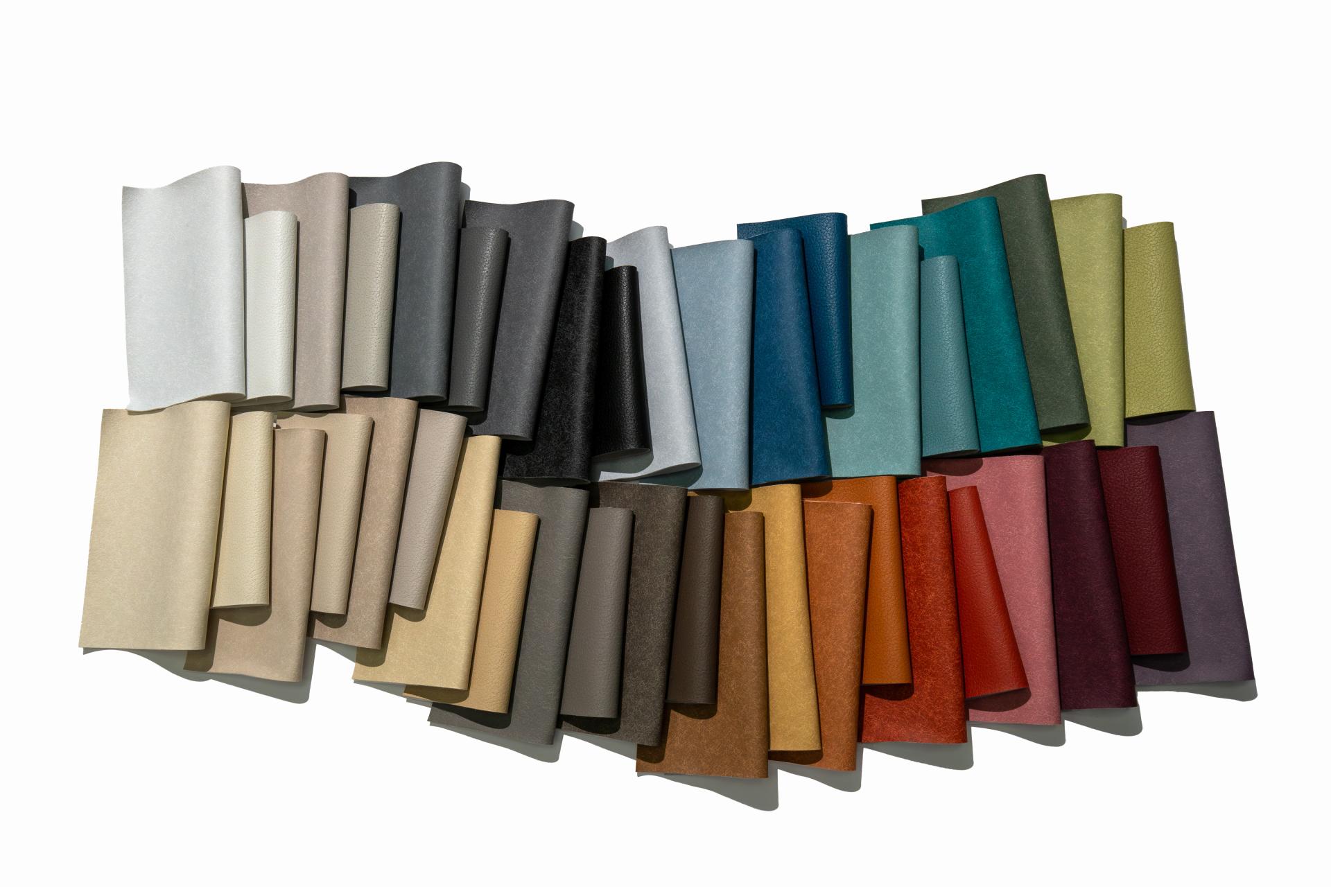 Vibrant rolls of Ultrafabrics' Ellora collection showcasing a variety of colors and textures in breathable materials.