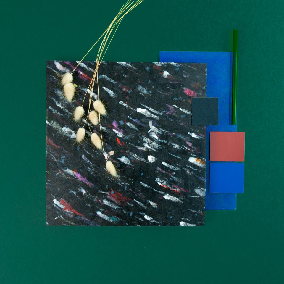 Colorful materials displayed with decorative natural elements, showcasing Smile Plastics' innovative designs for the Surface Design Show 2022.