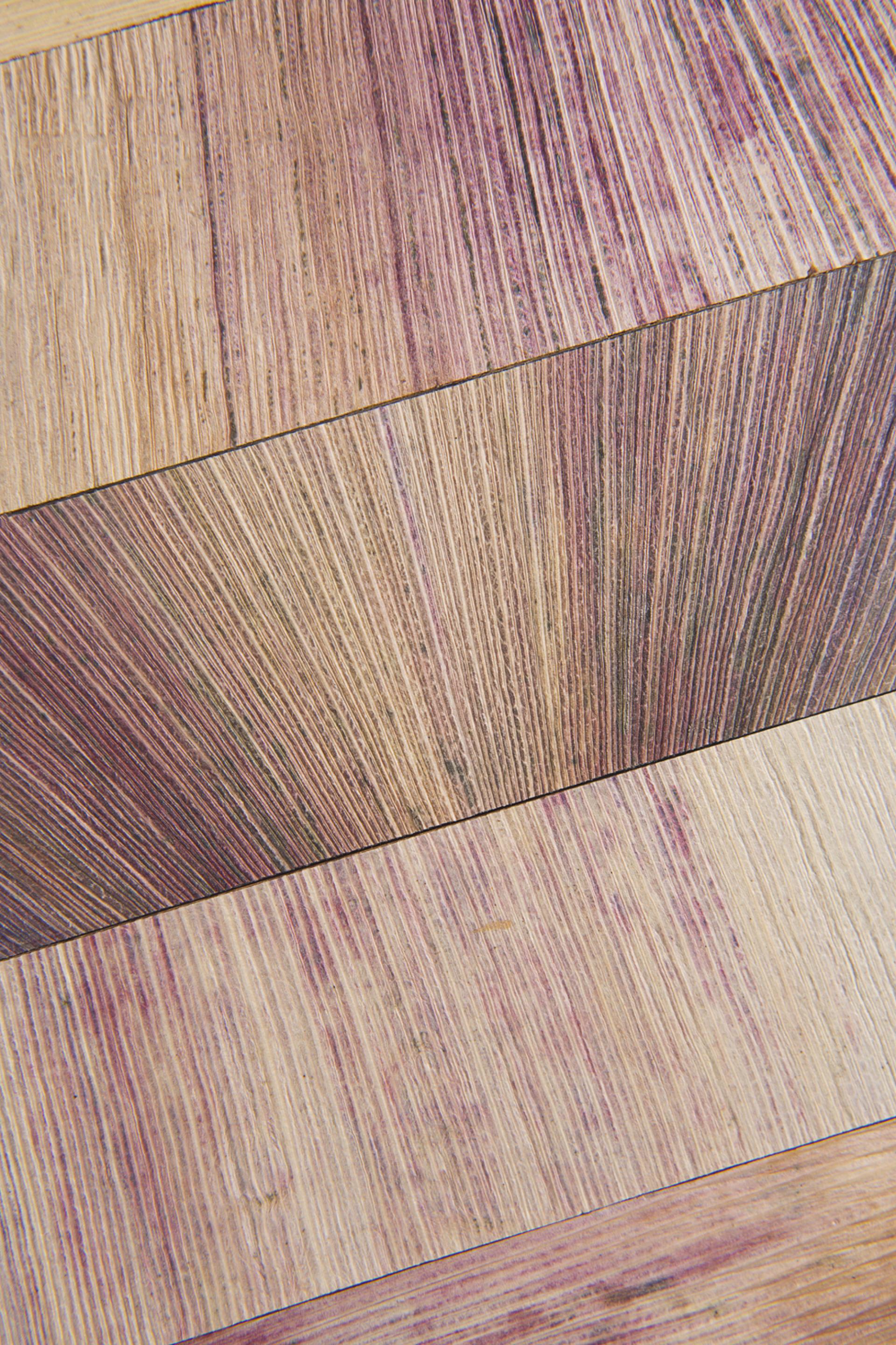 Natural wood patterns in vibrant colors, showcasing the unique beauty of Totomoxtle material derived from corn husks.