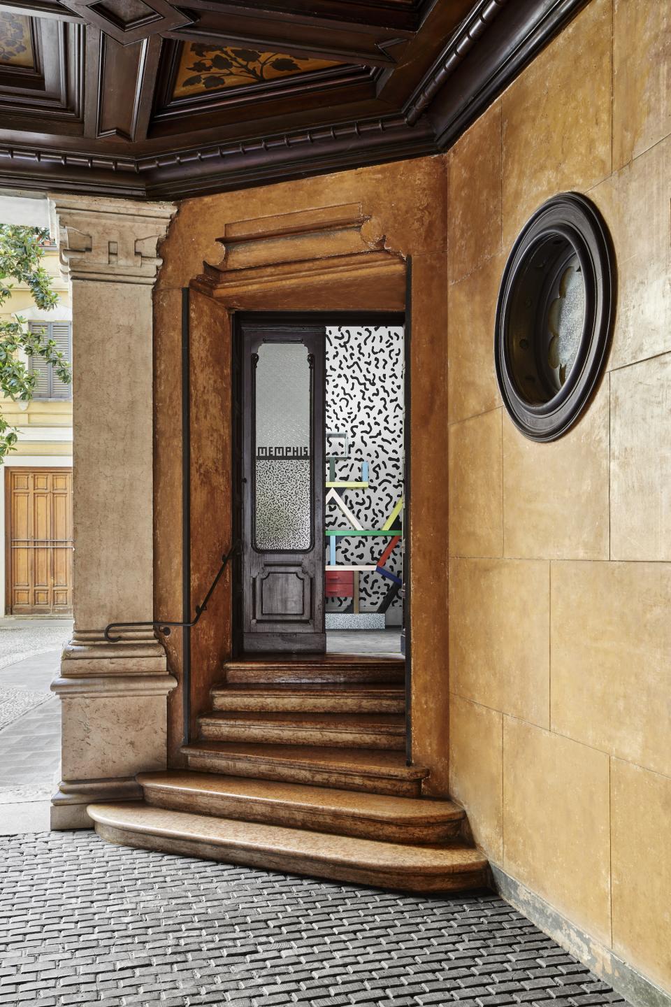 Entrance to the Post Design Gallery, showcasing Memphis Milano style with colorful geometric patterns and innovative design elements.