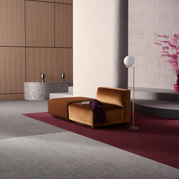 Luxurious interior design featuring sophisticated cut and loop flooring, stylish furniture, and vibrant plants in a modern setting.