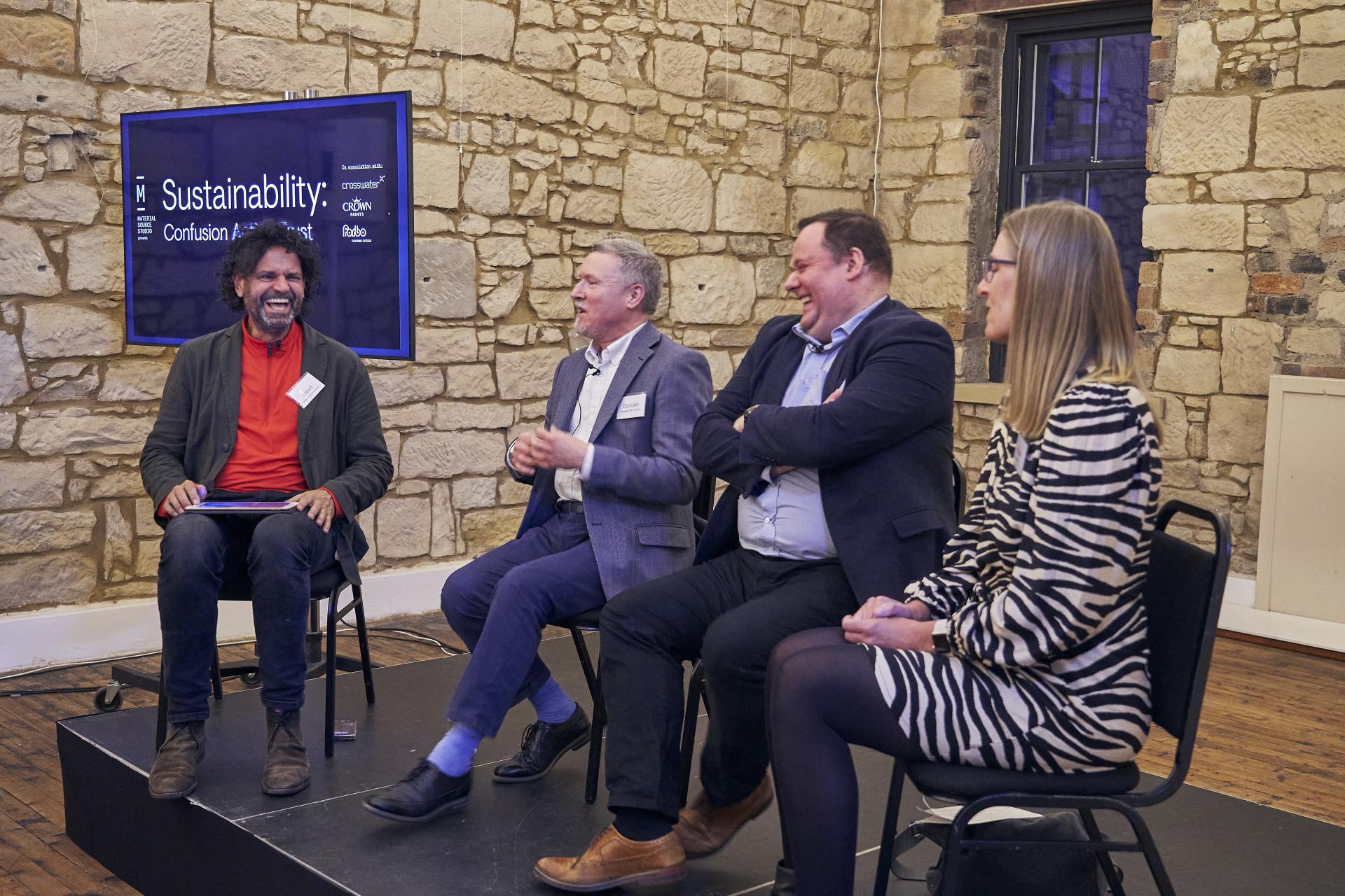 Discussion on sustainability at Material Source Studio Glasgow, featuring a diverse panel engaged in conversation.