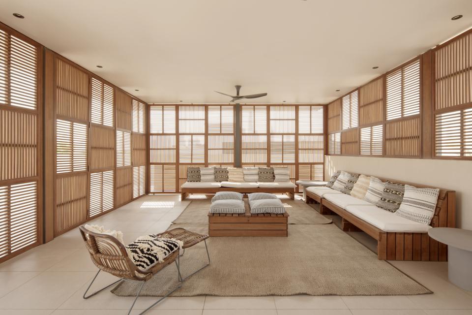 Stylish interior of Villa Jumeirah featuring wooden accents, cozy seating, and ambient natural light for a tranquil atmosphere.