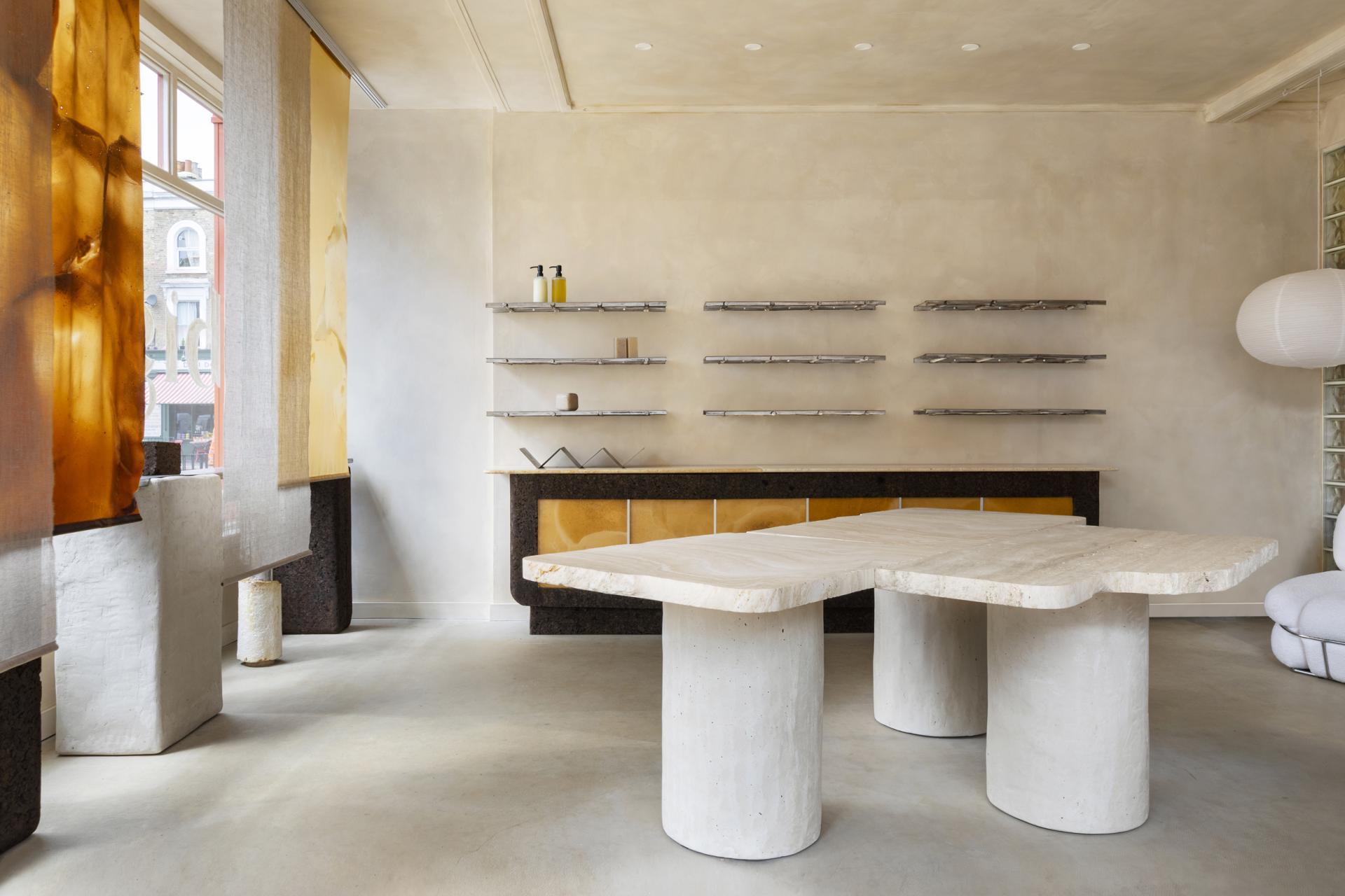 Stylish interior of big. store in East London featuring salvaged materials, circular design elements, and unique furniture.