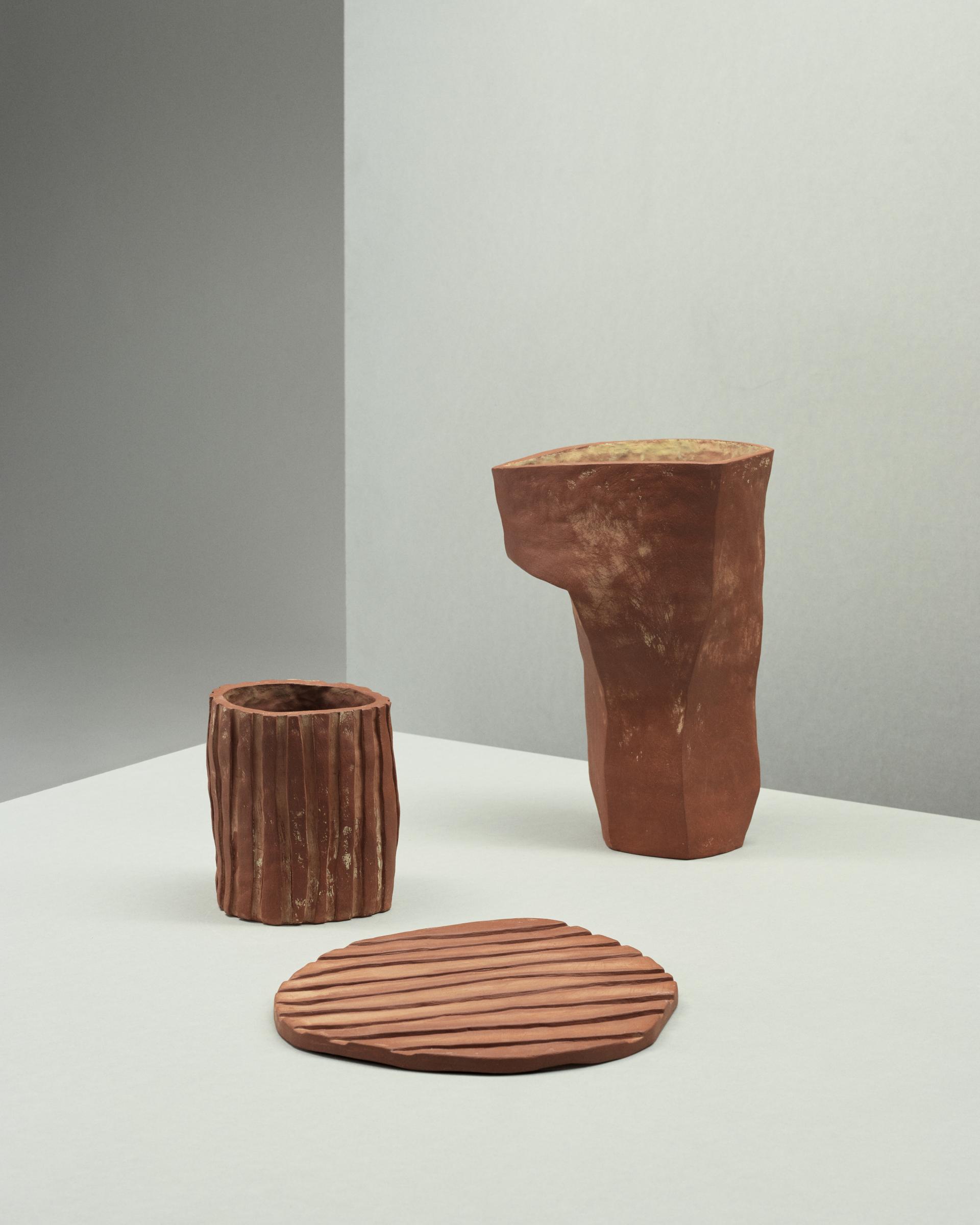 Minimalist ceramic sculptures showcasing Norwegian craftsmanship, emphasizing materiality and sustainable design at the 2023 Milan Design Week.