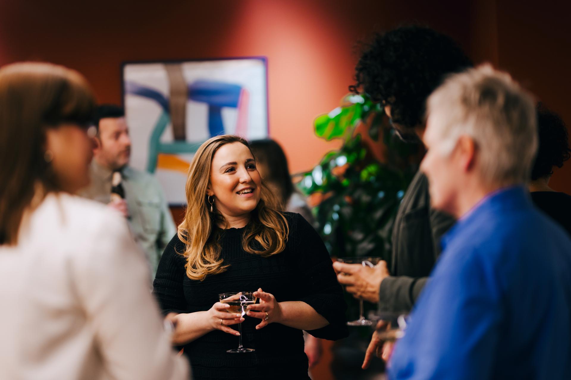 Attendees engaged in conversation during a neurodiversity discussion at Material Source Studio in Glasgow.