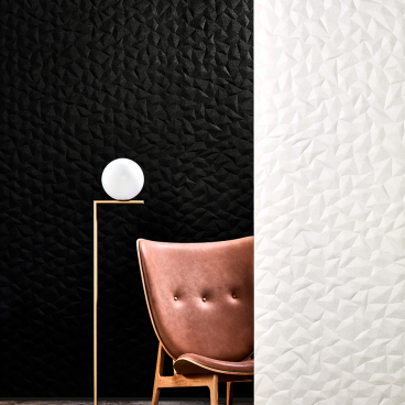 Tactile acoustic wall panel ION showcased alongside a modern chair and lamp, highlighting Japanese design influences.