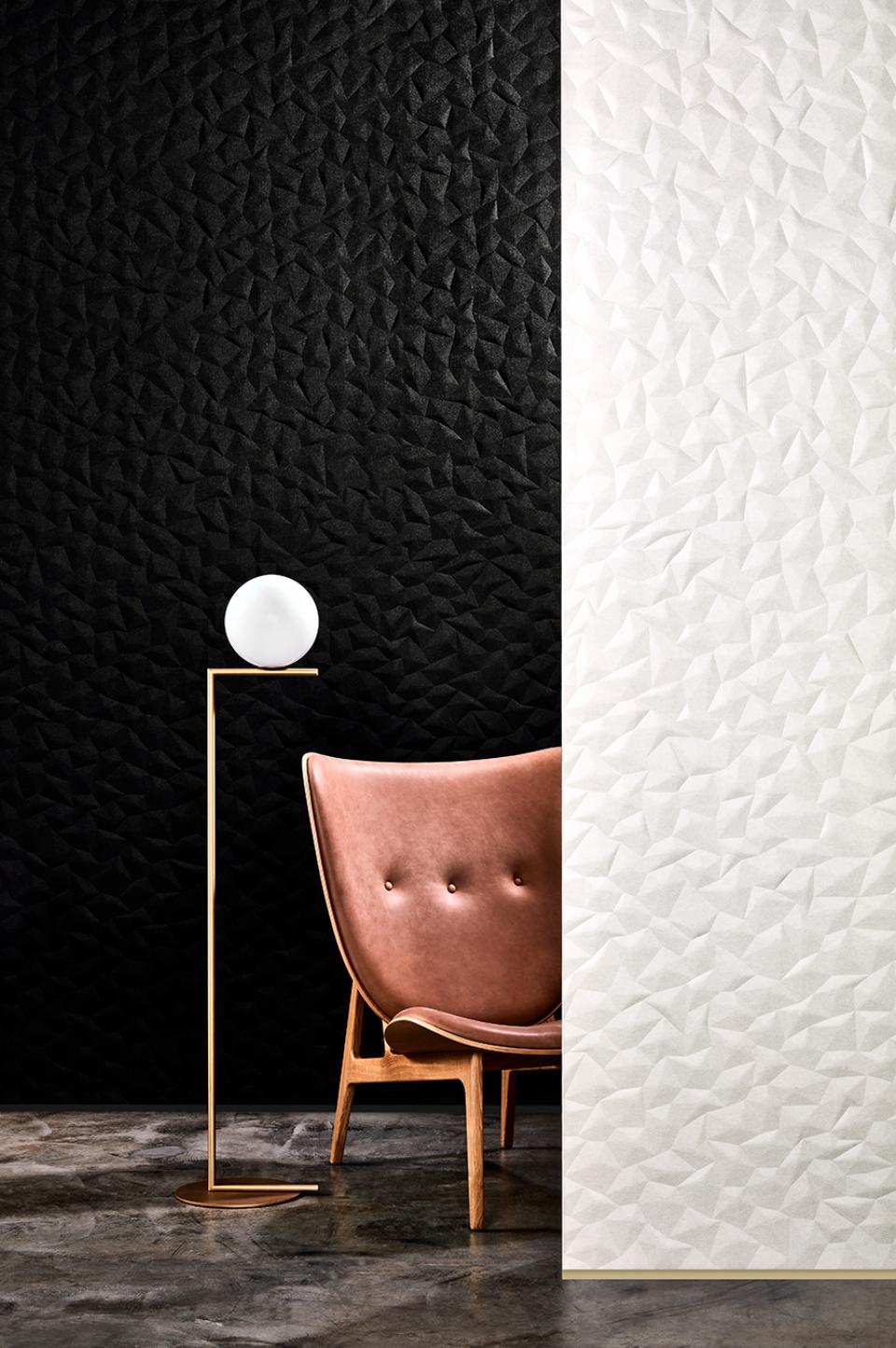Tactile acoustic wall panel ION showcased alongside a modern chair and lamp, highlighting Japanese design influences.