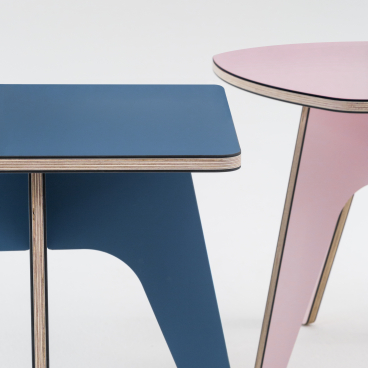 Colorful modern side tables in blue and pink showcased at designjunction on London's South Bank.