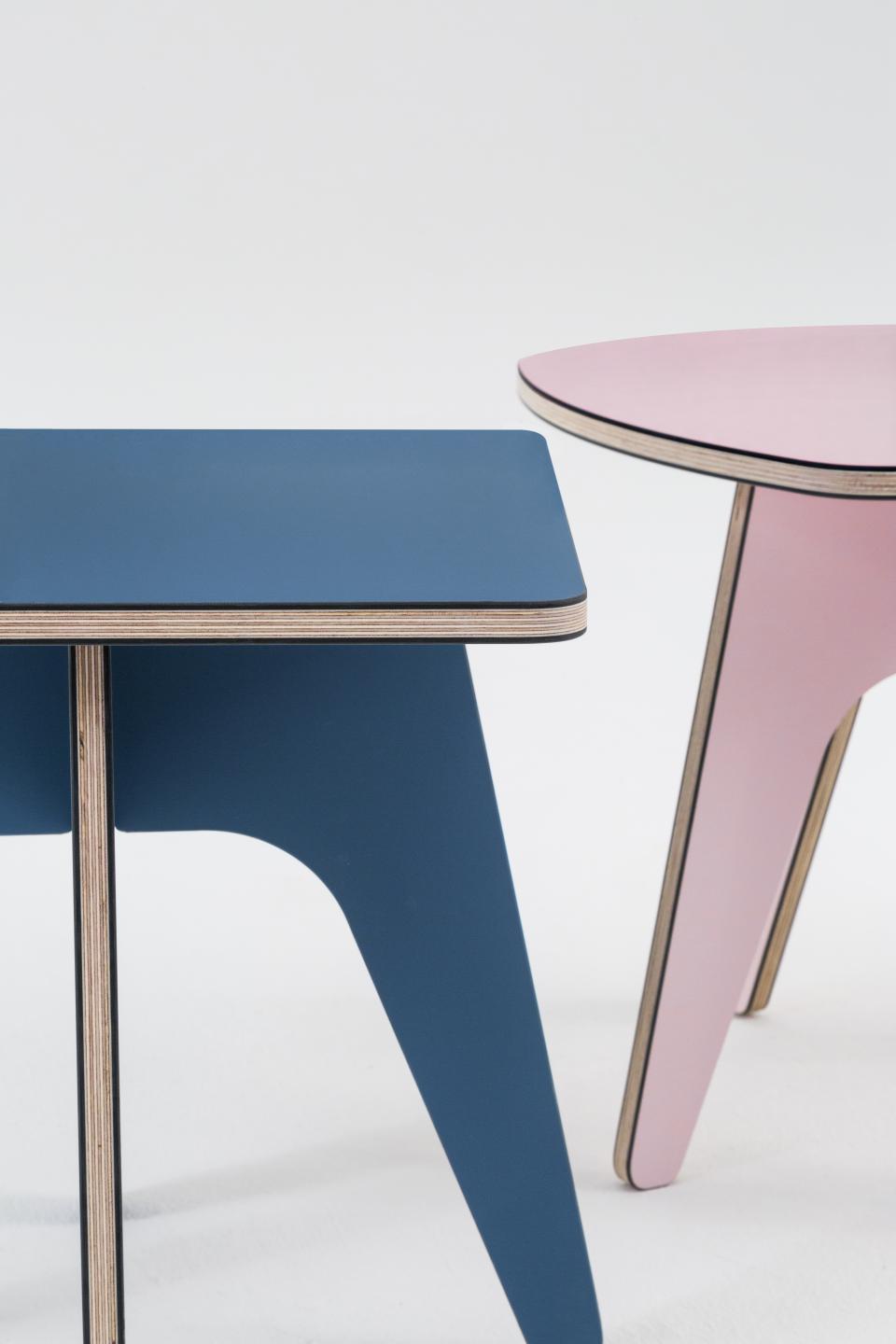 Colorful modern side tables in blue and pink showcased at designjunction on London's South Bank.