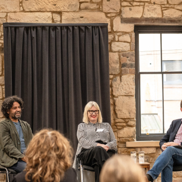 Panel discussion featuring experts at the Glasgow Property Outlook seminar, highlighting insights on local real estate trends.