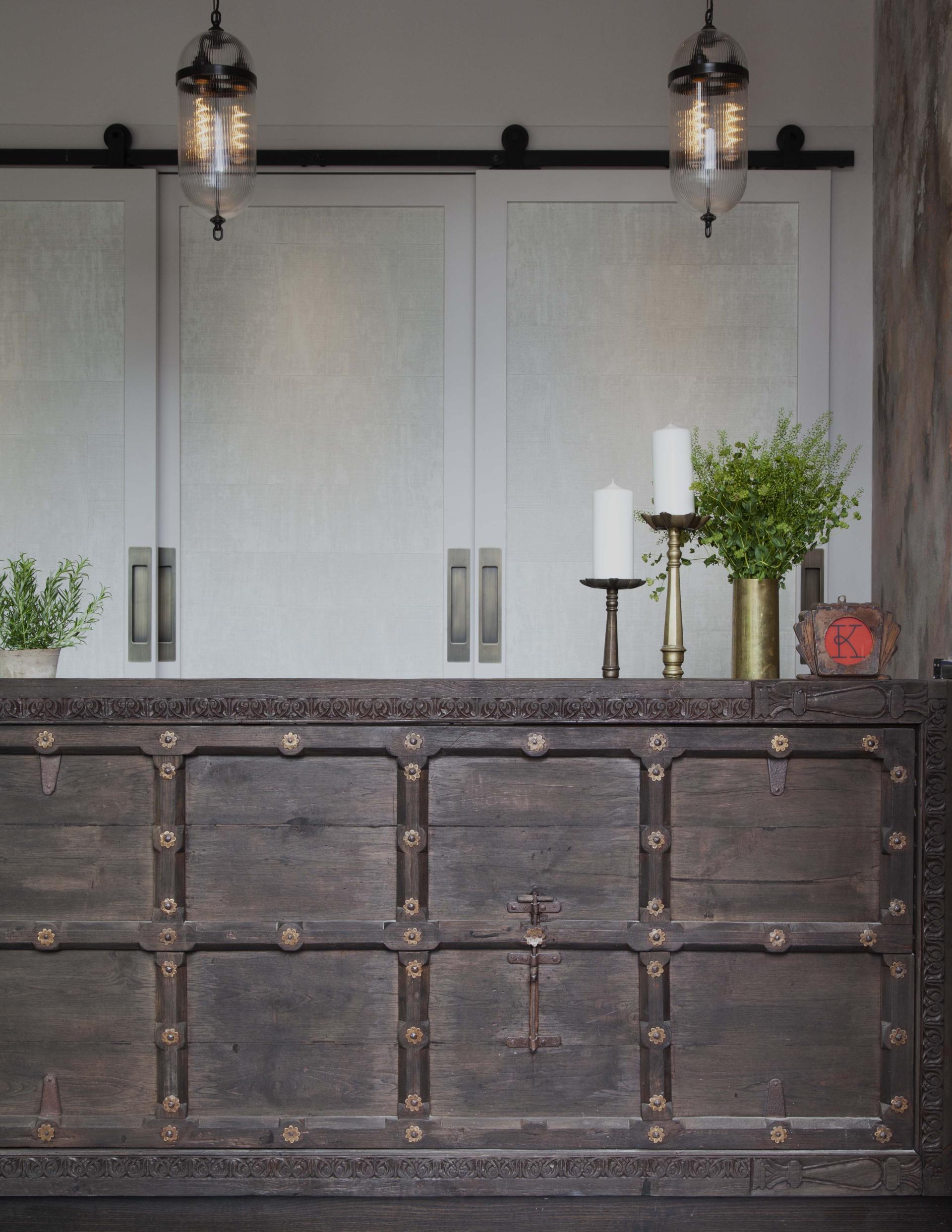 Rustic wooden bar with decorative hardware and greenery, designed for Kricket restaurant at Television Centre.