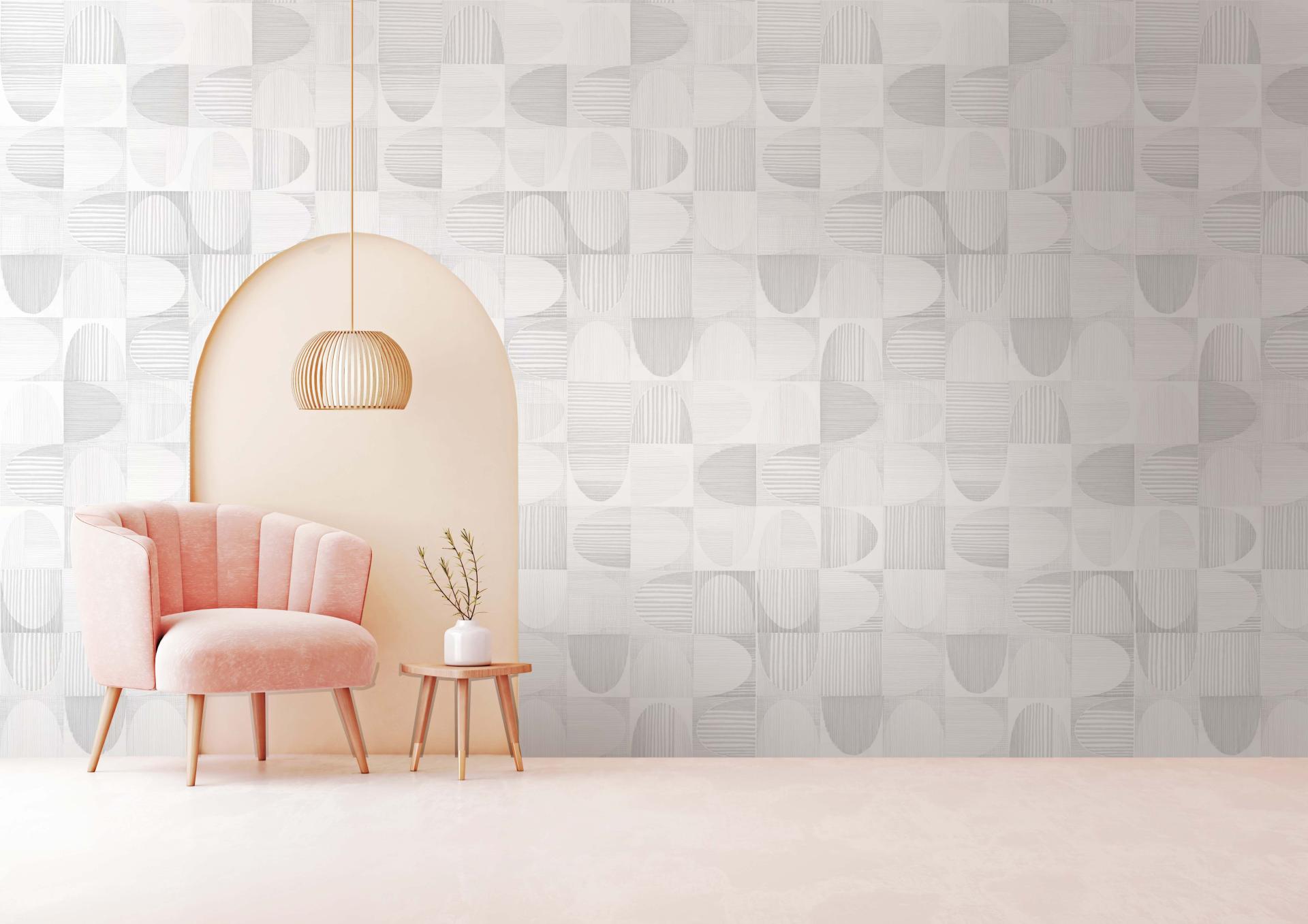Stylish commercial interior featuring textured Newmor wallcovering, a pink armchair, and a modern pendant light fixture.