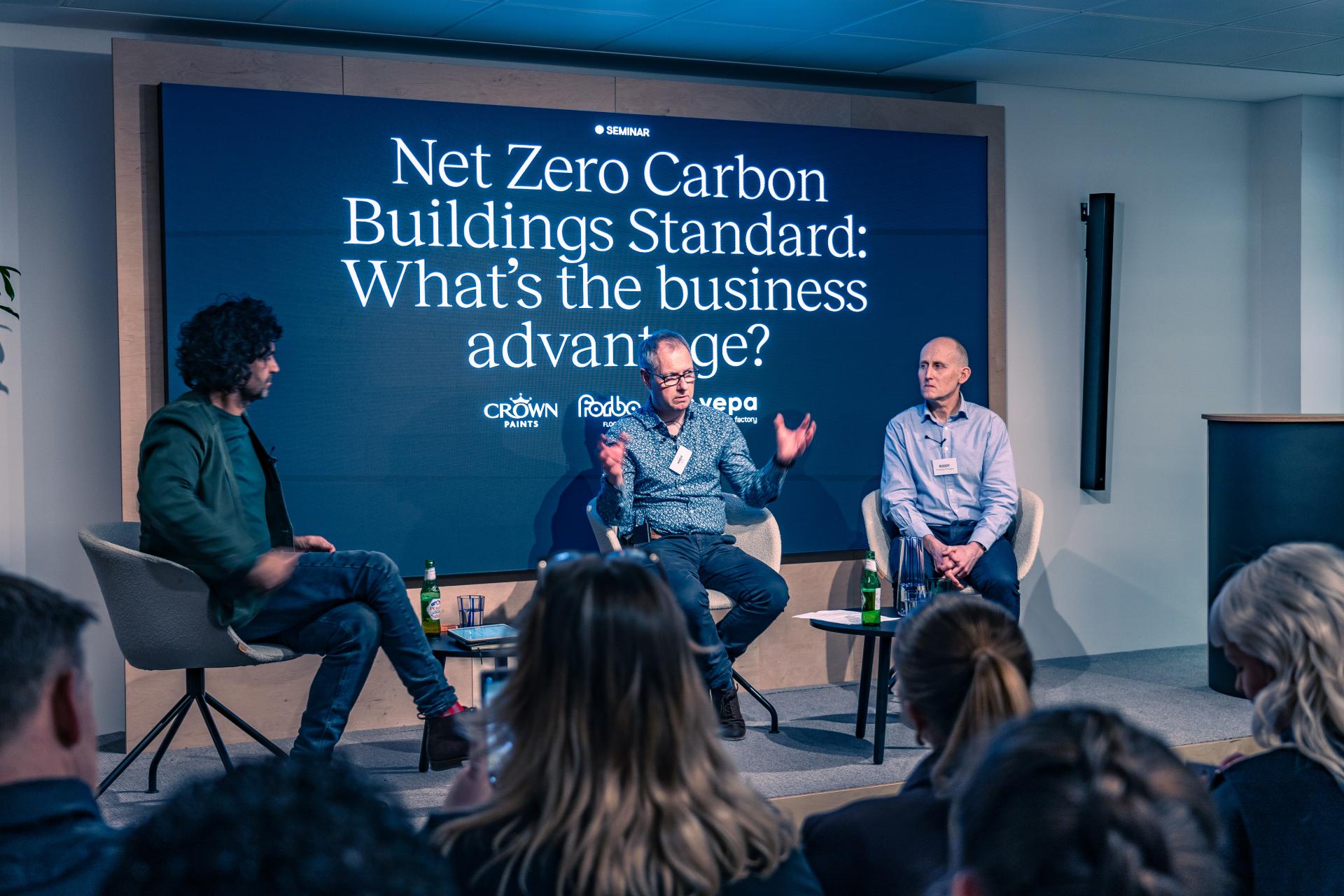 Panel discussion on Net Zero Carbon Buildings Standard, focusing on business advantages in sustainable construction practices.