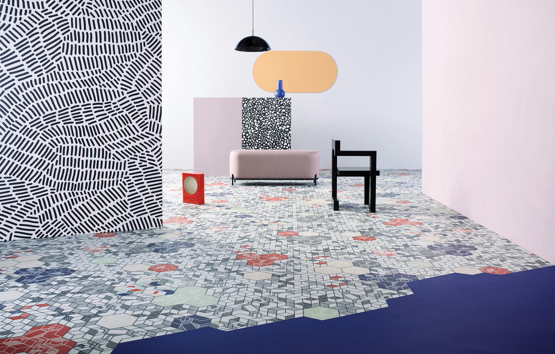 Colorful patterned flooring and modern furniture showcase innovative interior design elements at Material Source Studio.
