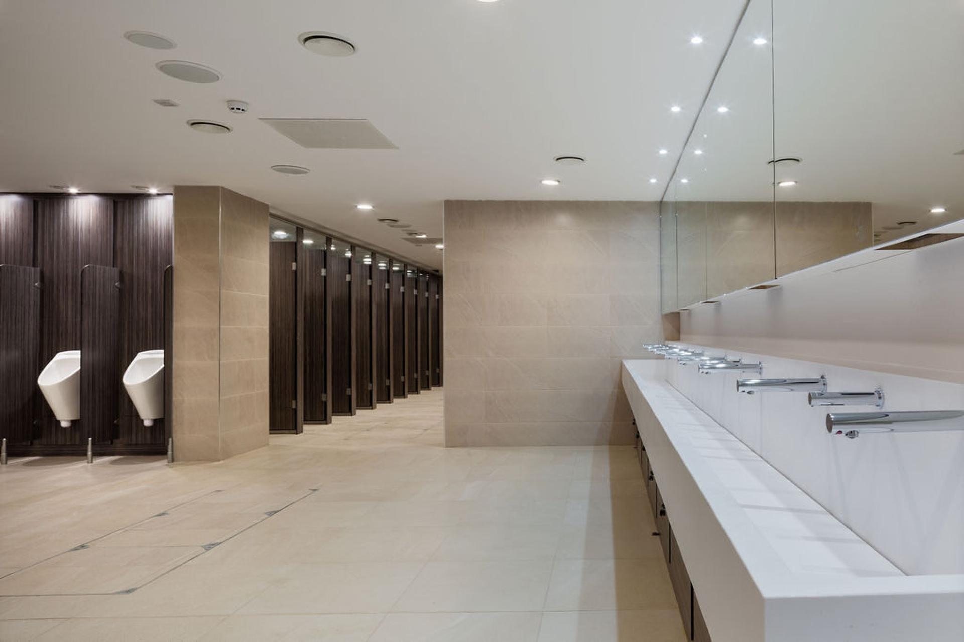Modern washroom design featuring sleek fixtures and spacious layout at Liverpool Street Station.