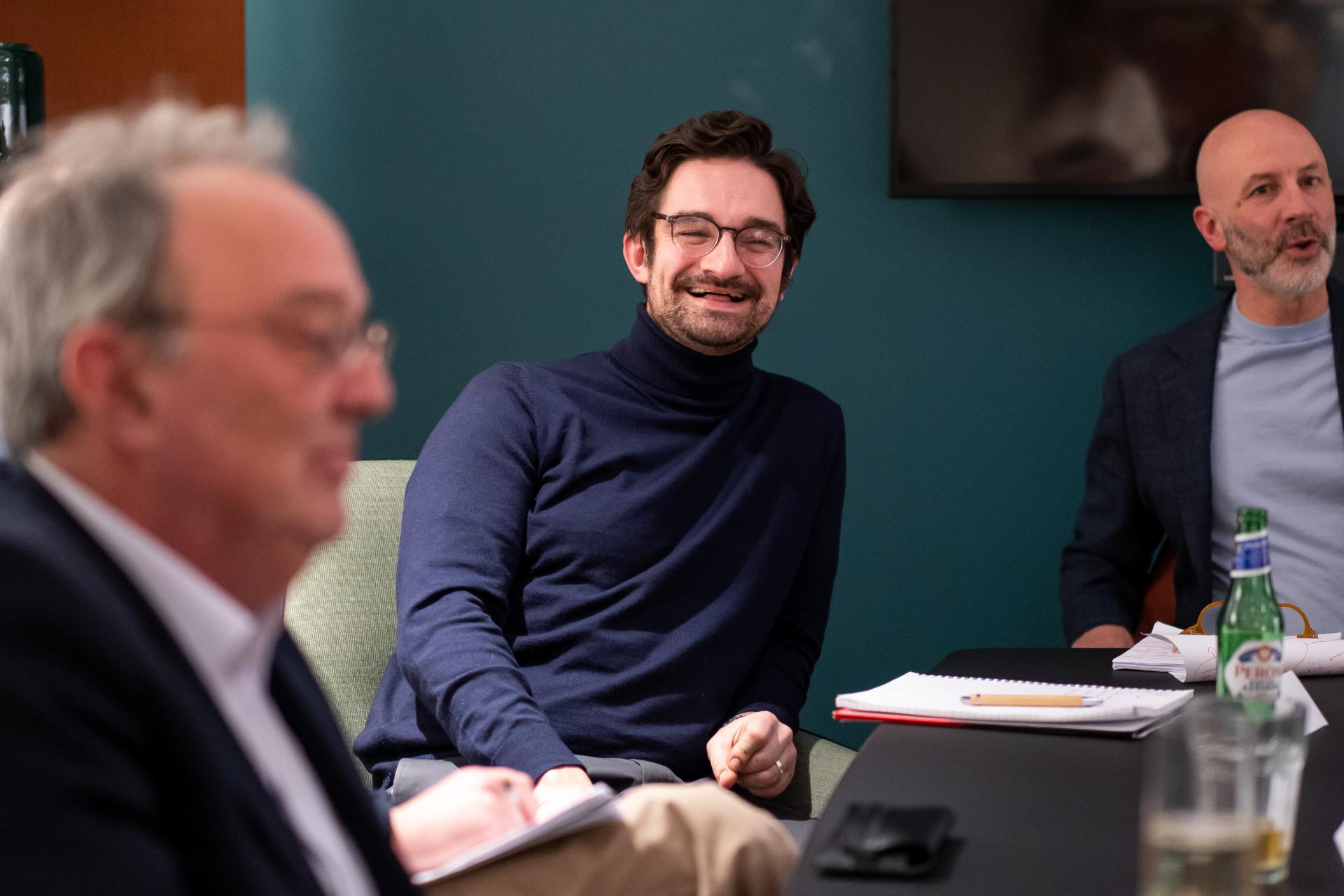 Participants engaged in discussion about sustainability during a seminar, highlighting collaboration and innovative ideas.