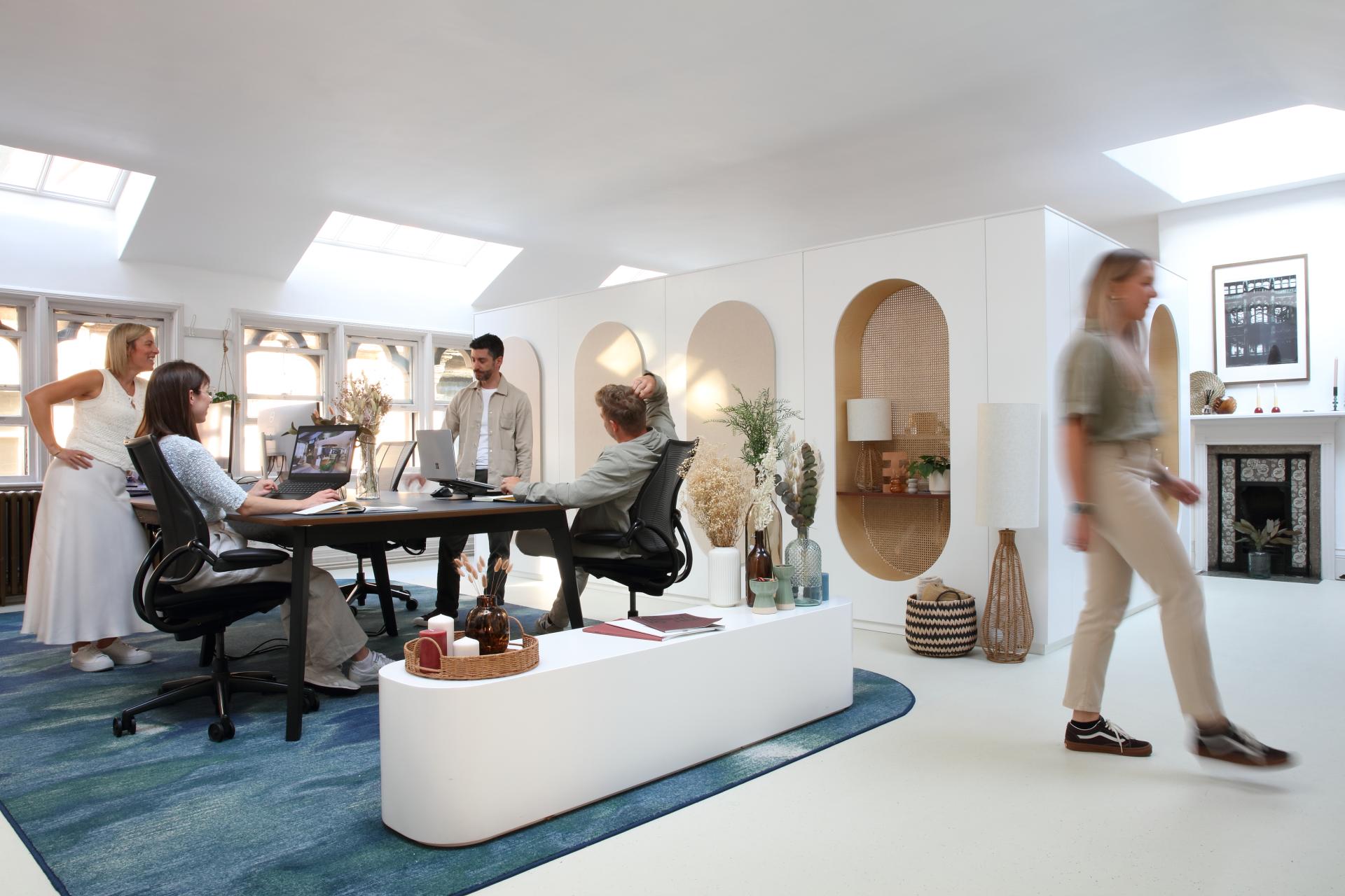 Modern interior design workspace featuring Simon Millington and his team collaborating creatively in a bright, stylish office.