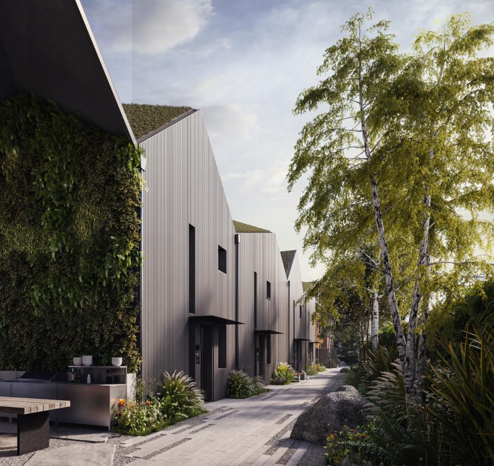 Sustainable residential development at Orford Mews in East London, featuring modern architecture and lush landscaping.