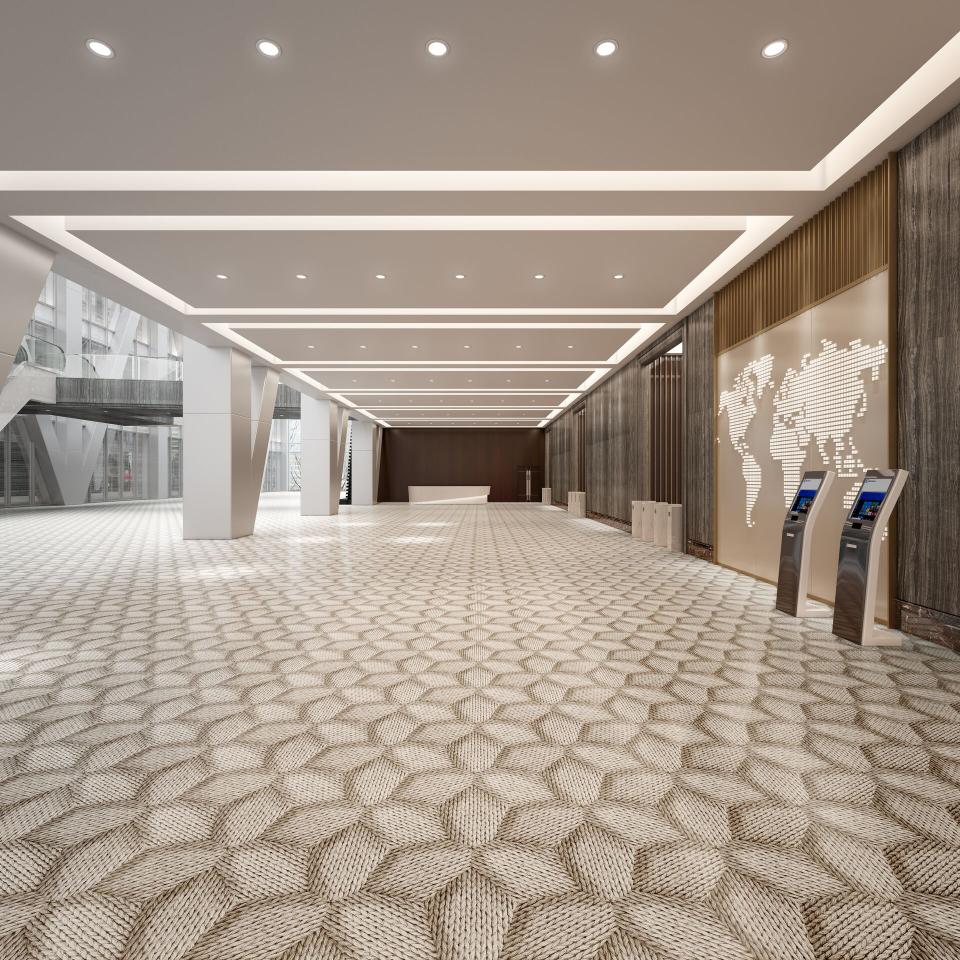 Elegant commercial space featuring Mac Stopa's artistic flooring design with geometric patterns and modern lighting elements.