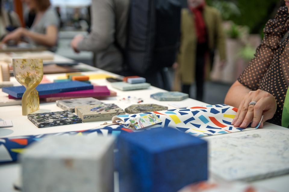 Showcasing colorful material samples and designs at the Surface Design Show 2022, emphasizing sustainable design trends and creativity.