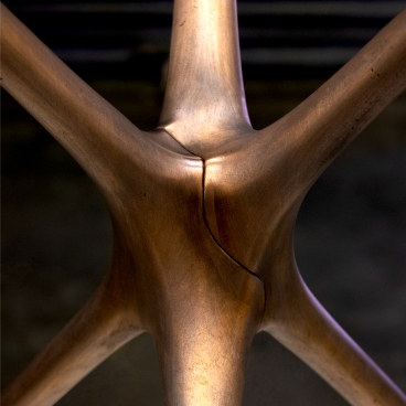 Innovative close-up of Brodie Neill's Supernova trestle design, showcasing its sleek, modern shape and metallic finish.