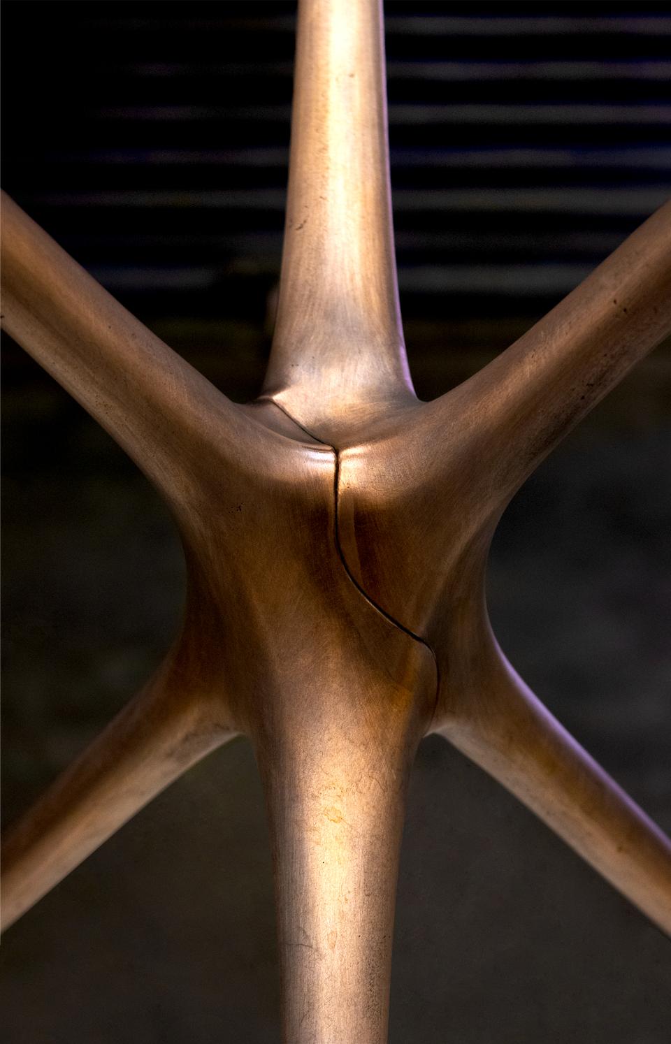 Innovative close-up of Brodie Neill's Supernova trestle design, showcasing its sleek, modern shape and metallic finish.