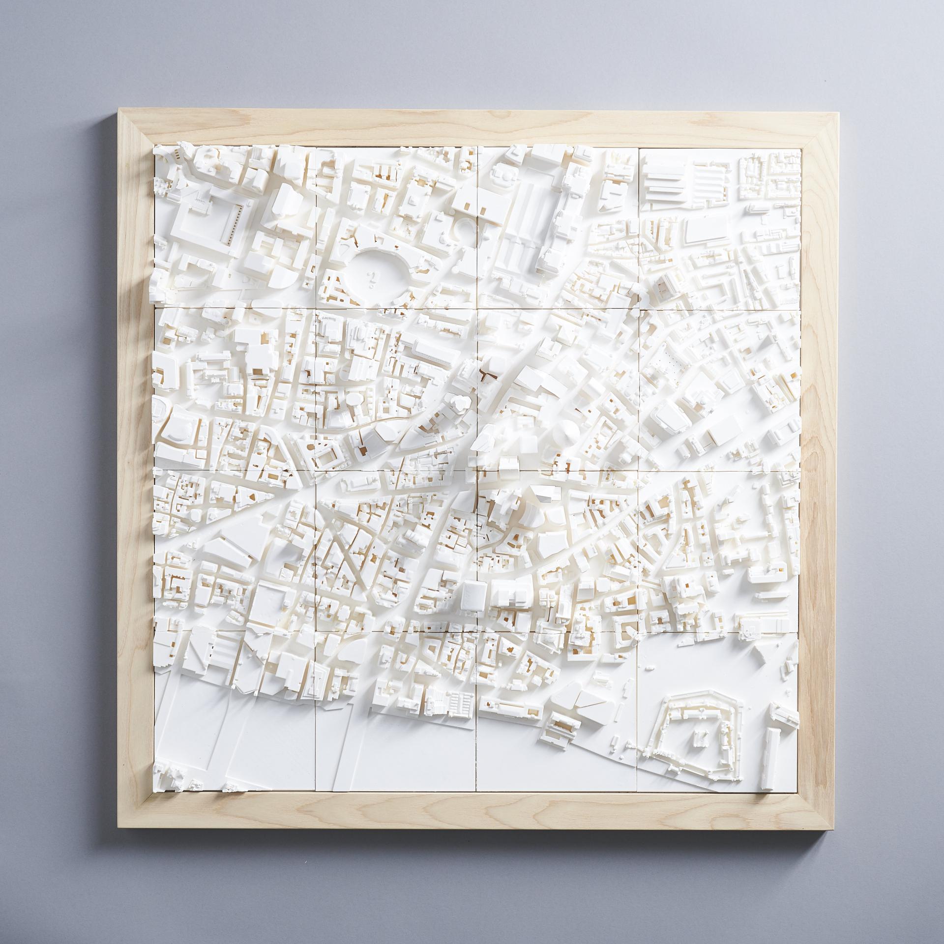 Three-dimensional urban landscape model showcasing intricate city structures and layouts, emphasizing architectural details and city identity.