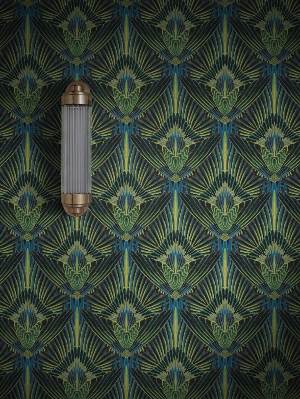 Glamorous peacock-inspired wallpaper design by Divine Savages, featuring rich green tones and elegant detailing.