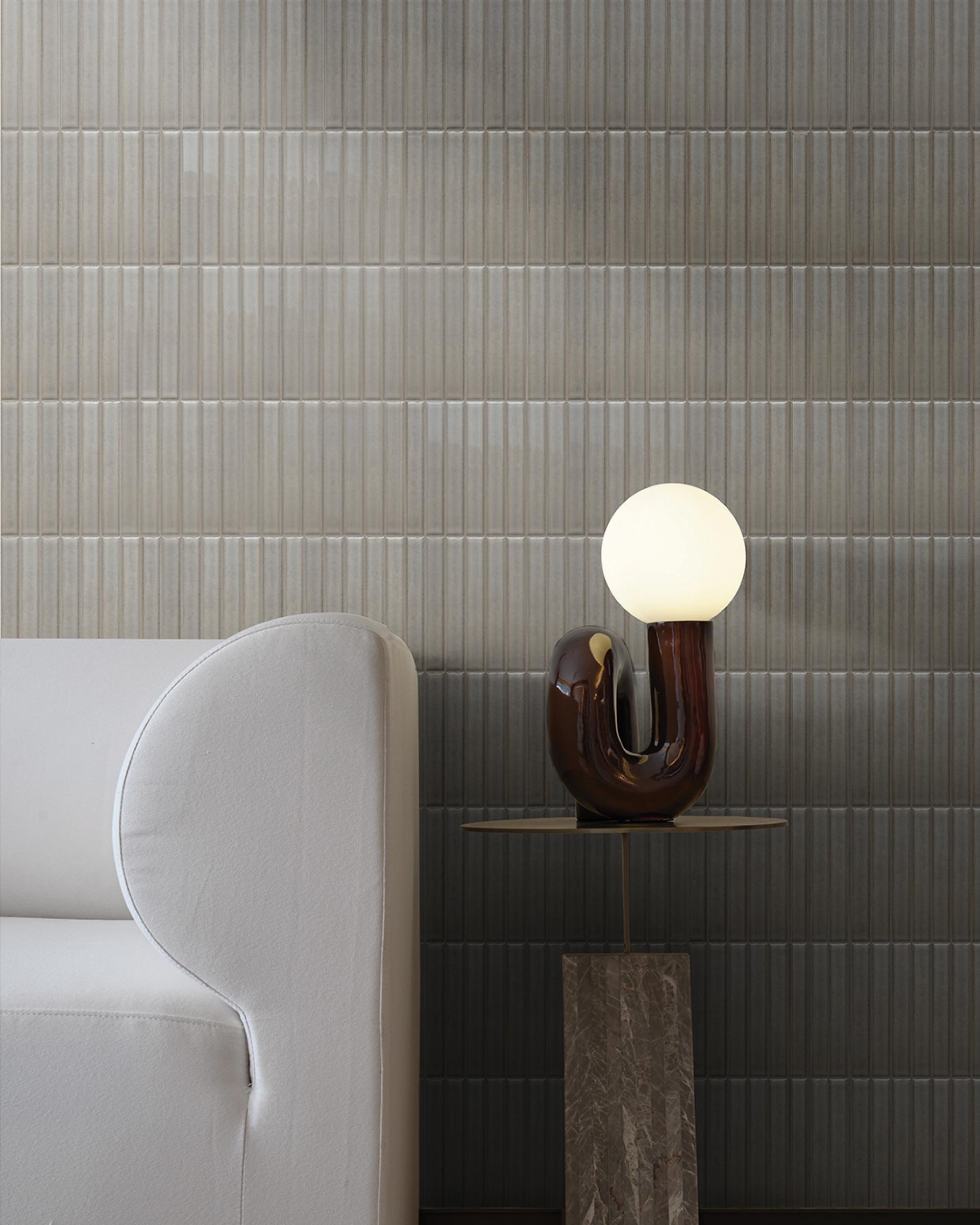 Porcelain mosaic tiles from the Kakam 2.0 collection displayed on a wall, showcasing traditional Japanese glazing techniques and modern design.