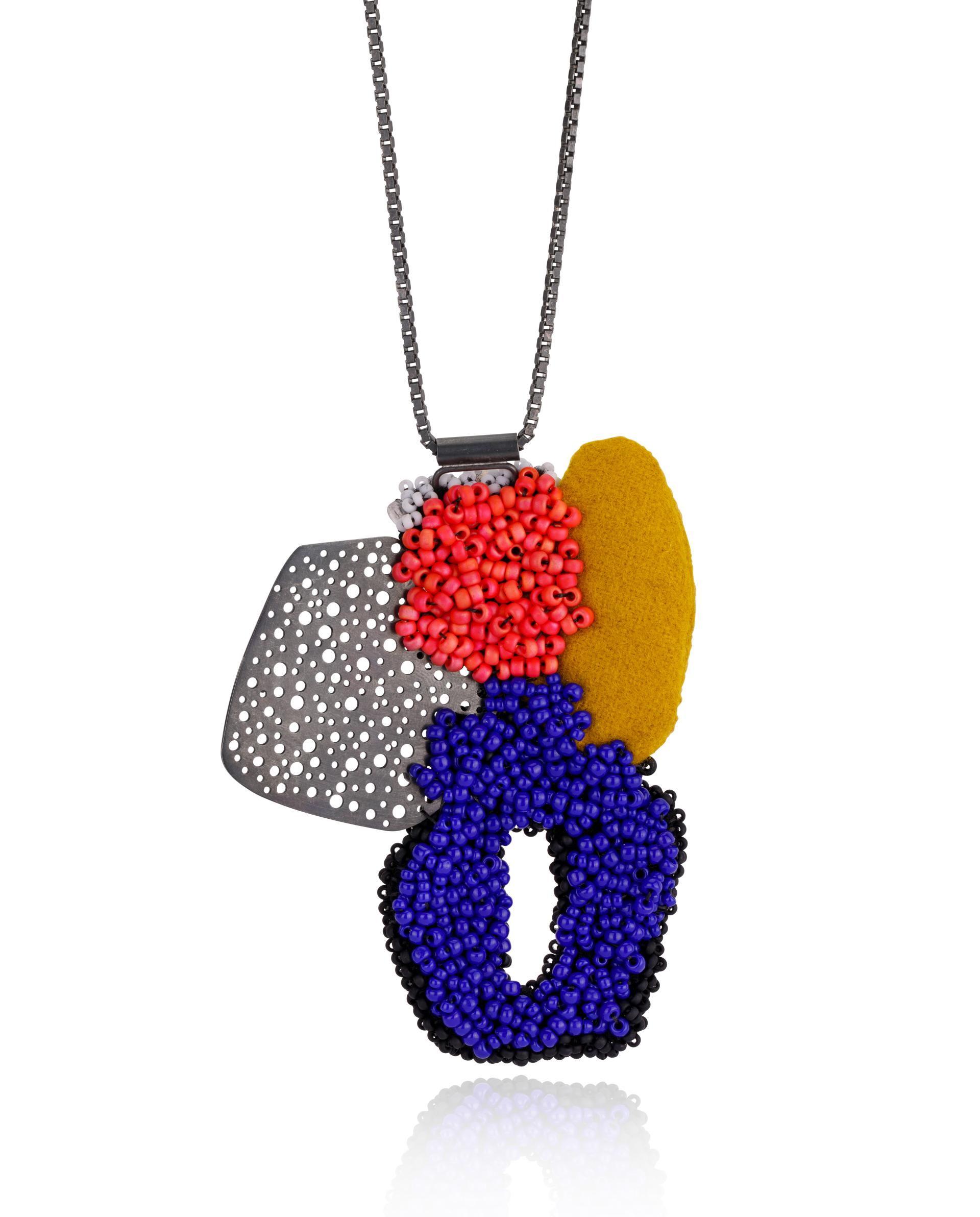 Colorful contemporary necklace featuring various textured elements, showcased at the Future Icons Selects exhibition during London Craft Week 2023.