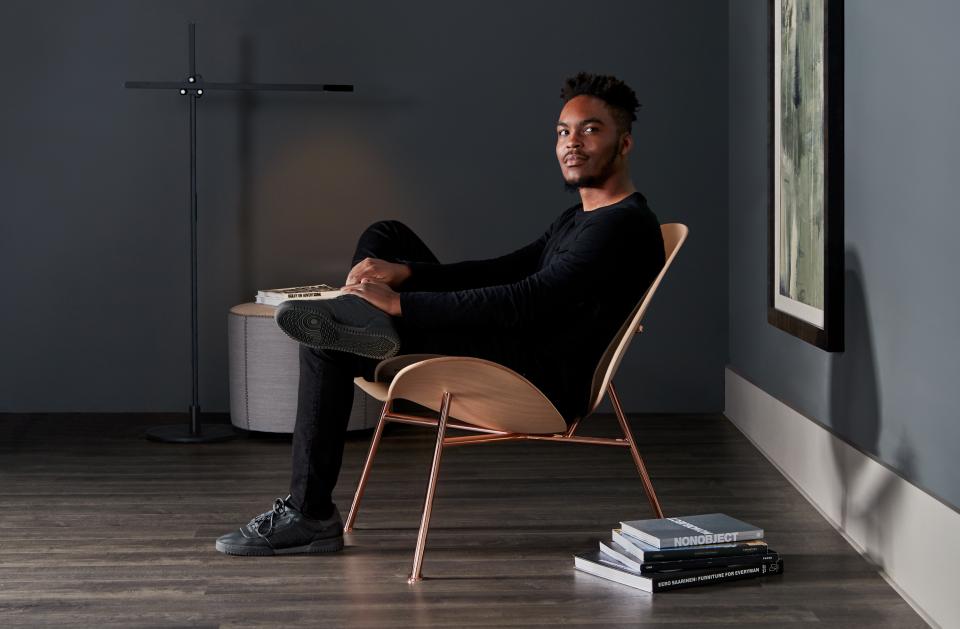 Pedersen lounge chair by Thomas Pedersen, showcasing modern design with a seated individual in a stylish setting.