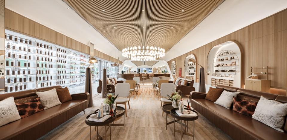 Modern café interior designed by Karv One, featuring stylish seating, elegant lighting, and vibrant coffee displays.