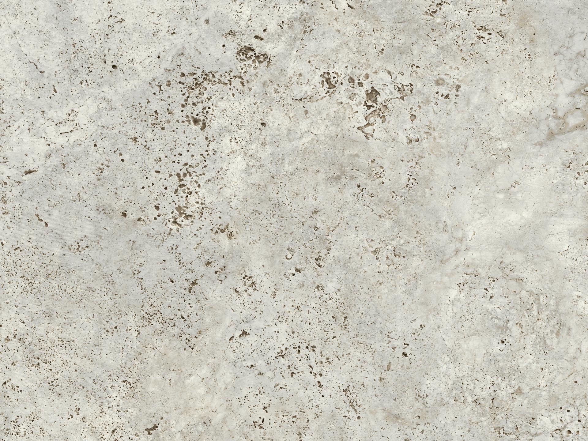 Light grey stone surface resembling natural marble, featuring subtle speckles and a textured finish, from Cosentino's Dekton® Pietra Kode collection.