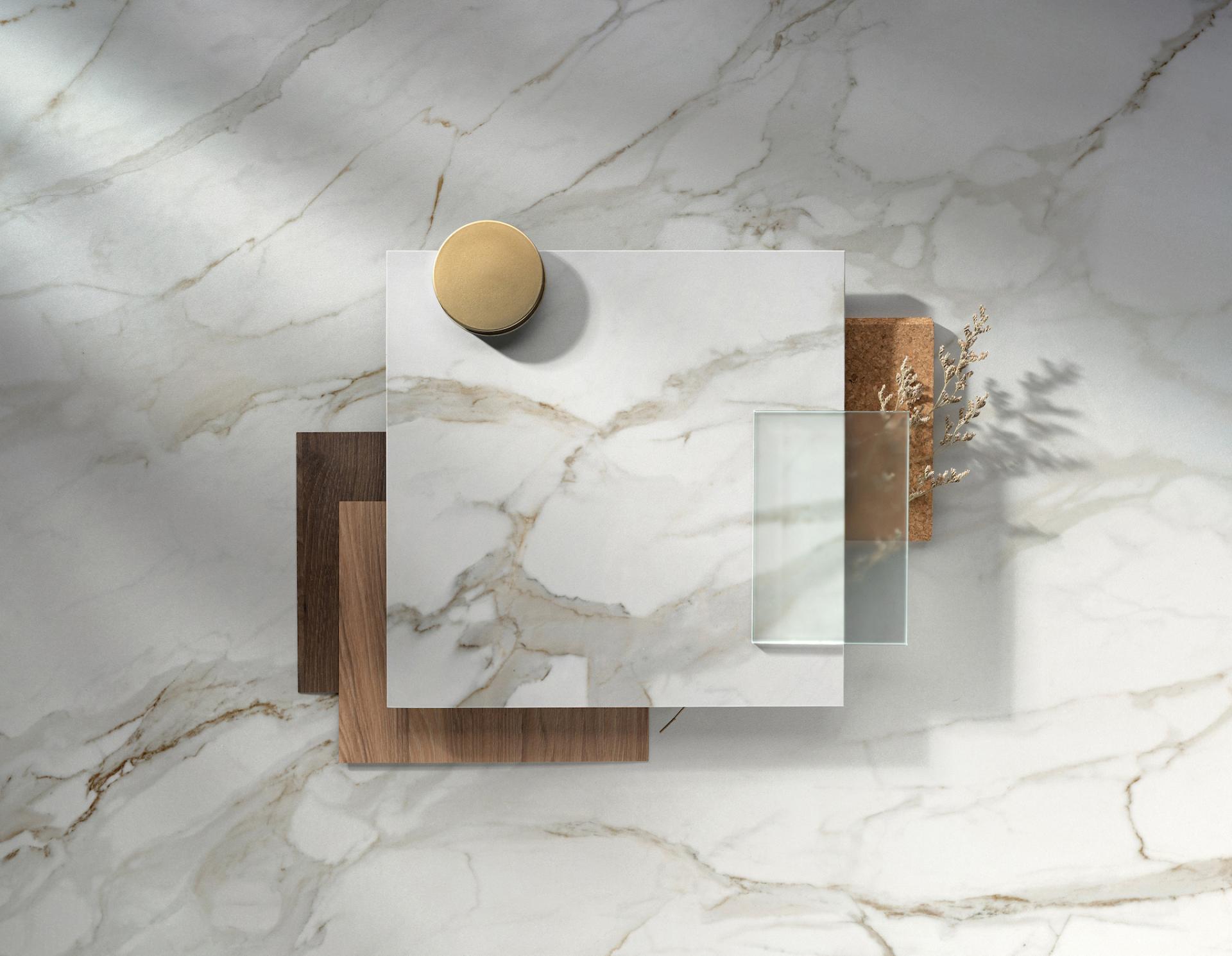 Dekton® Onirika and Kraftizen samples displayed on a elegant surface showcasing innovative textures and colors for modern interiors.