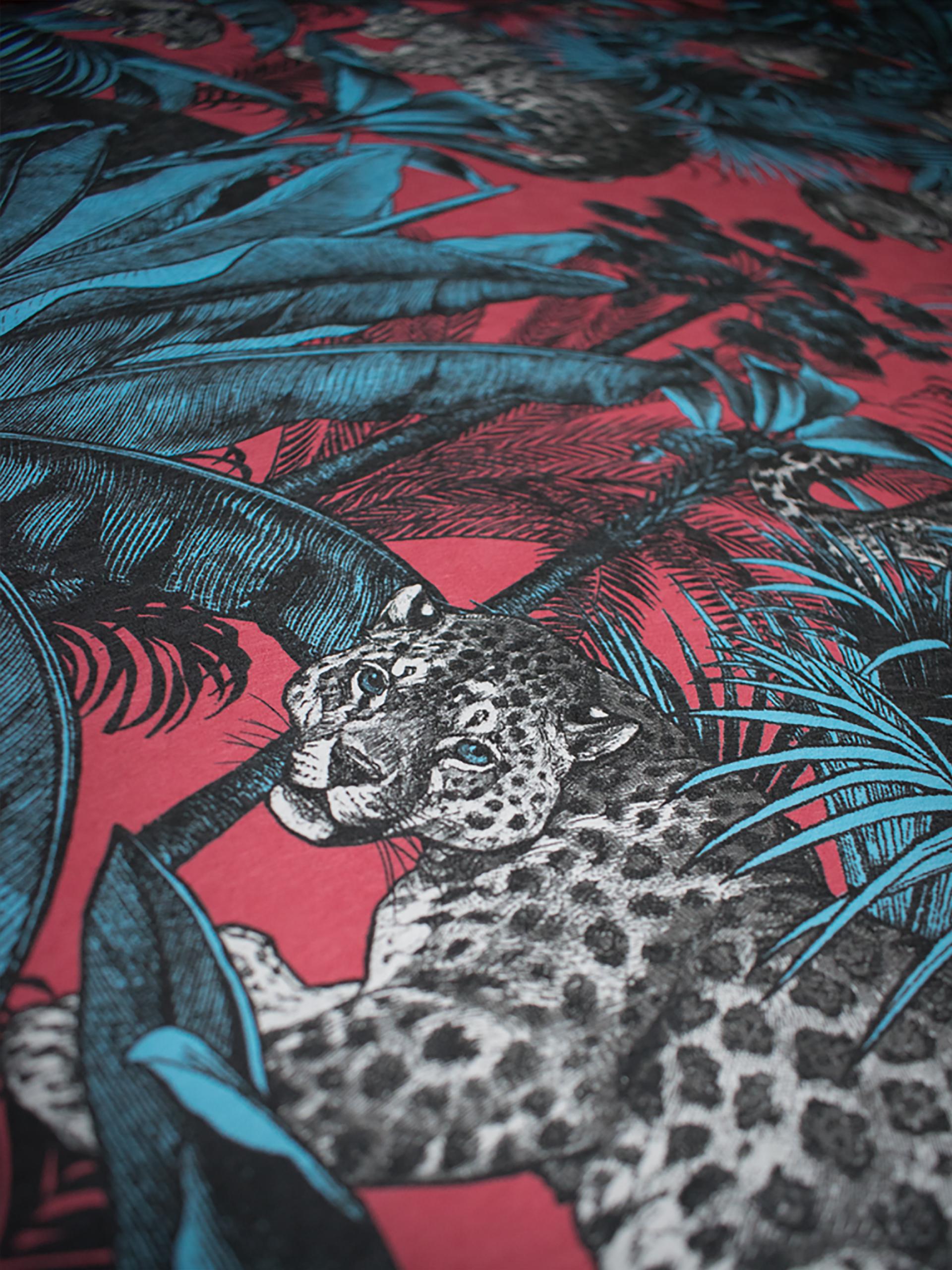 Vibrant leopard wallpaper design featuring bold blue leaves and a striking red background, perfect for decadent interior decor.