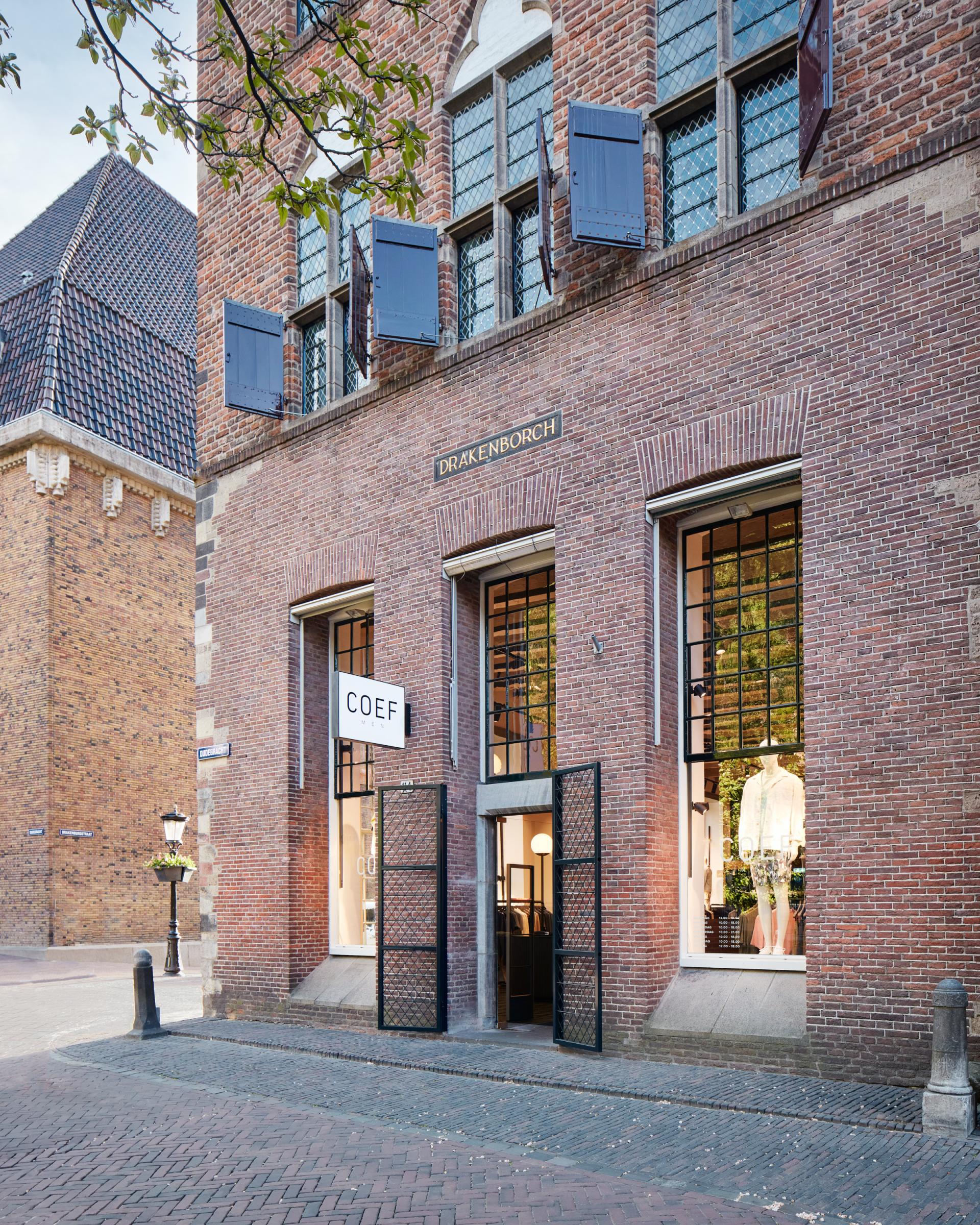 COEF clothing store in the historic Drakenborch building, featuring modern designs in a charming Utrecht setting.