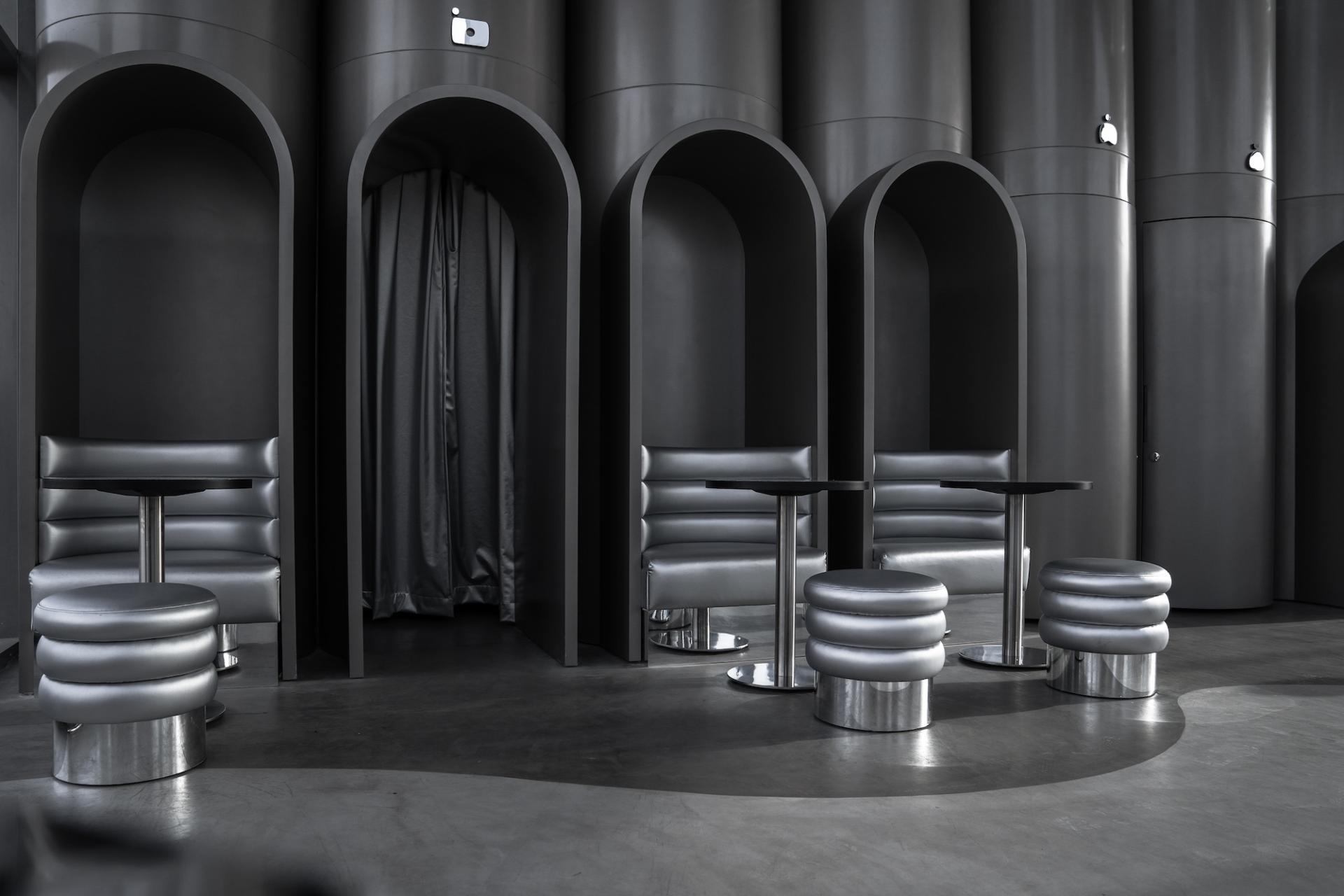 Modern seating area in MO bakehouse and espresso bar, featuring sleek design elements and a futuristic aesthetic.