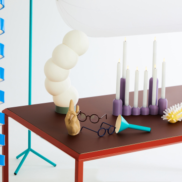 Colorful ceramics and playful design elements, including candles and decorative objects, featured at DDW 2023.