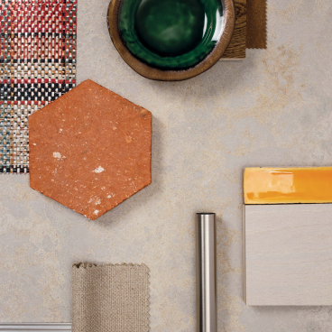 Various textured materials and samples, including tile, fabric, and metal, showcasing Caesarstone's 4043 Primordia aesthetic.