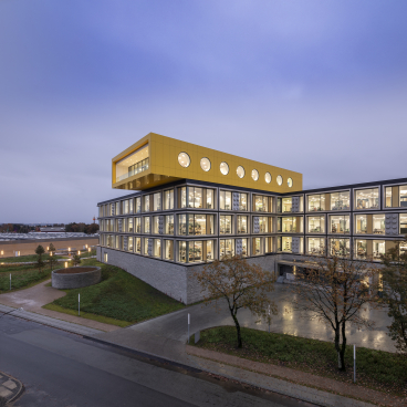 LEGO Group's innovative office building features a modern design with vibrant colors, enhancing creativity for employees.