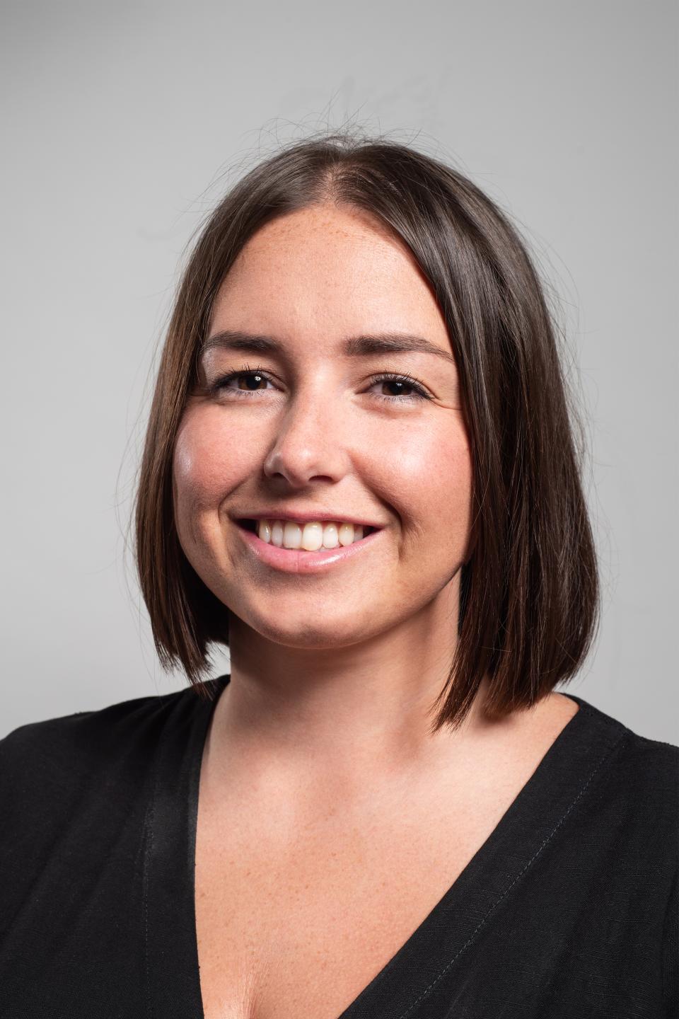 Katie Lea, Head of Design at No Chintz, smiling in a black top, showcasing creativity in design and inspiration.