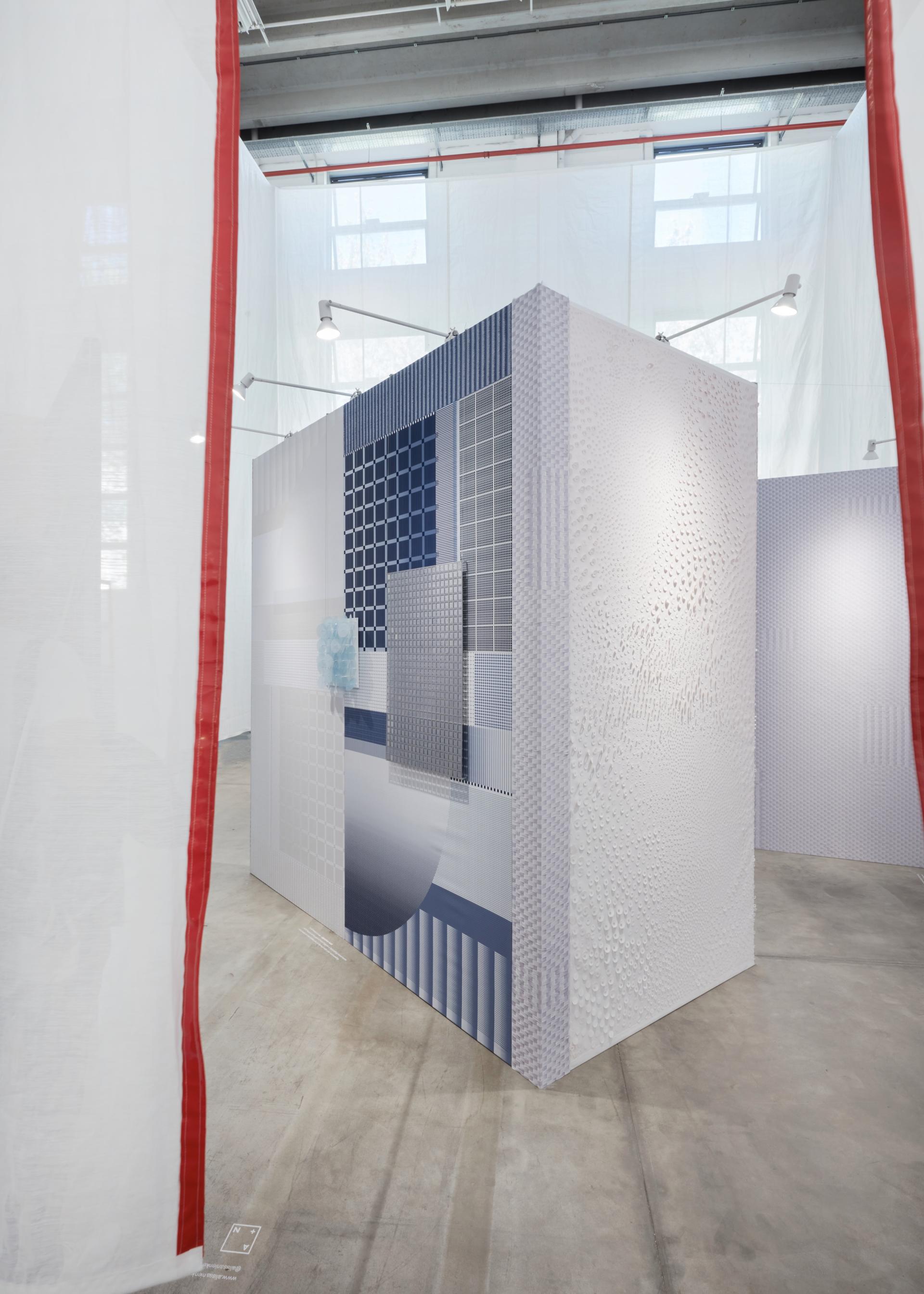 Abstract architectural installation featuring textured surfaces and biotechnological designs, highlighting sensory experiences in restorative interior spaces.