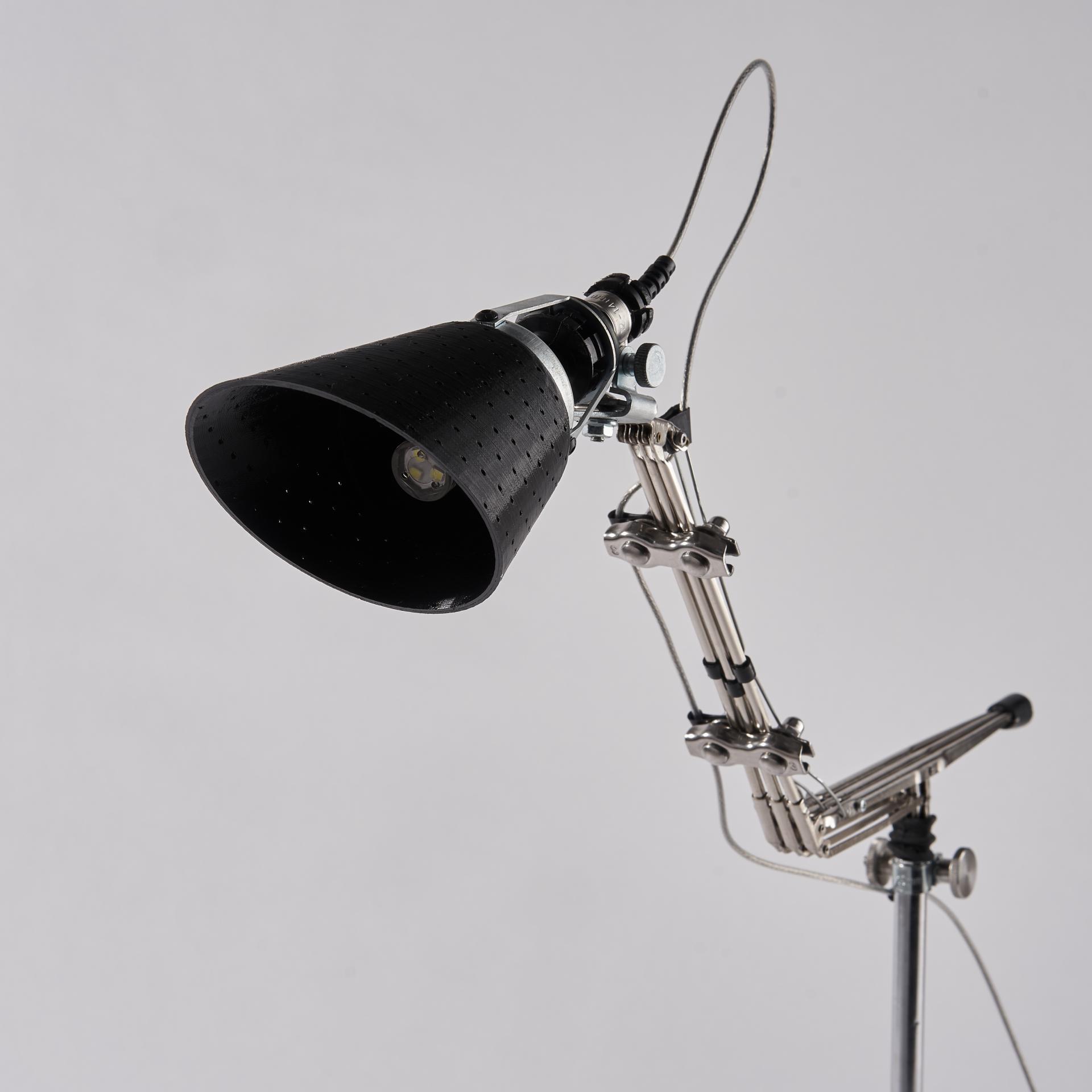 Upcycled lamp made from discarded umbrellas, showcasing a unique design and eco-friendly materials for sustainable lighting.