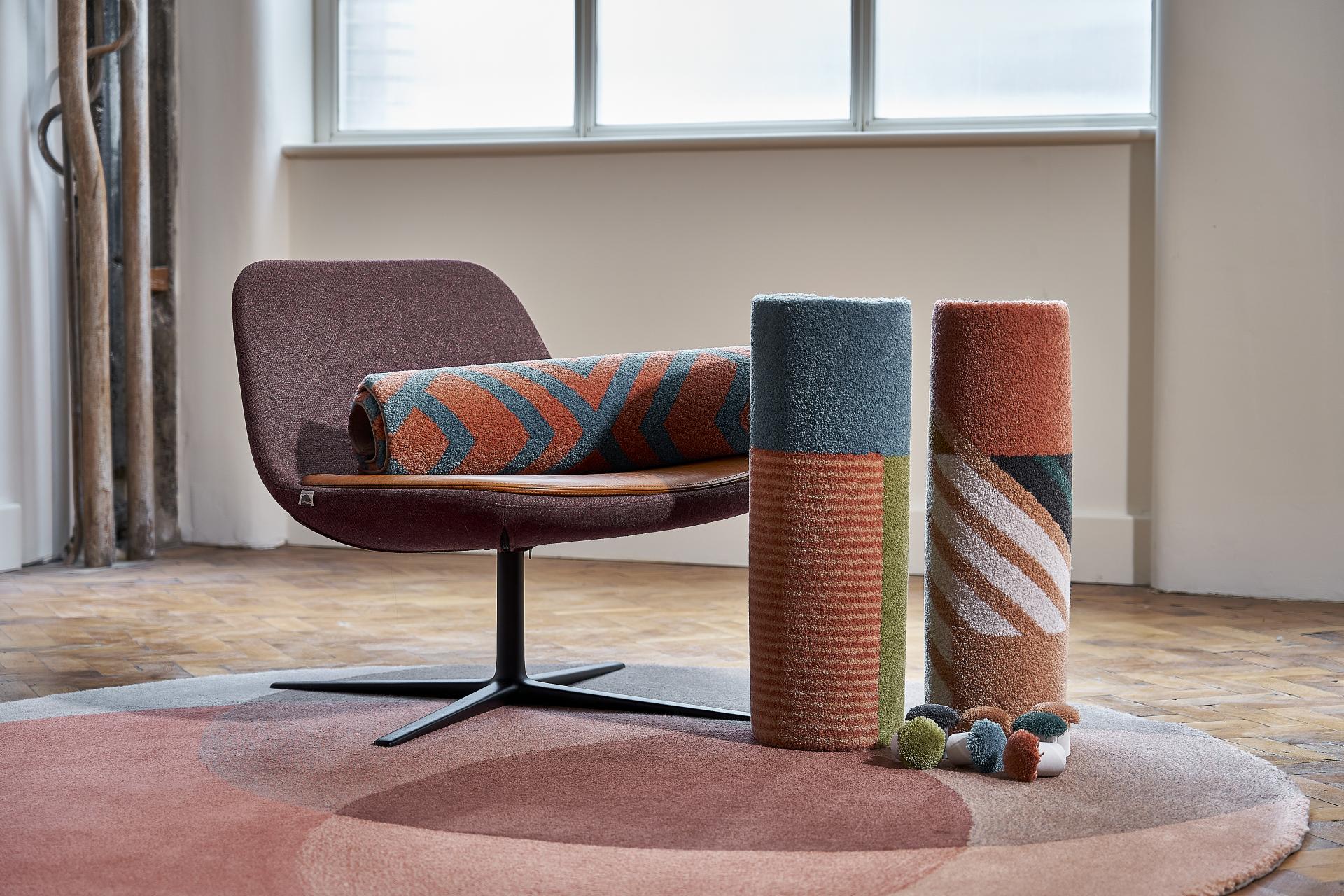 Stylish chair with patterned rugs and rolls, showcasing modern interior design elements for Material Source Studio.