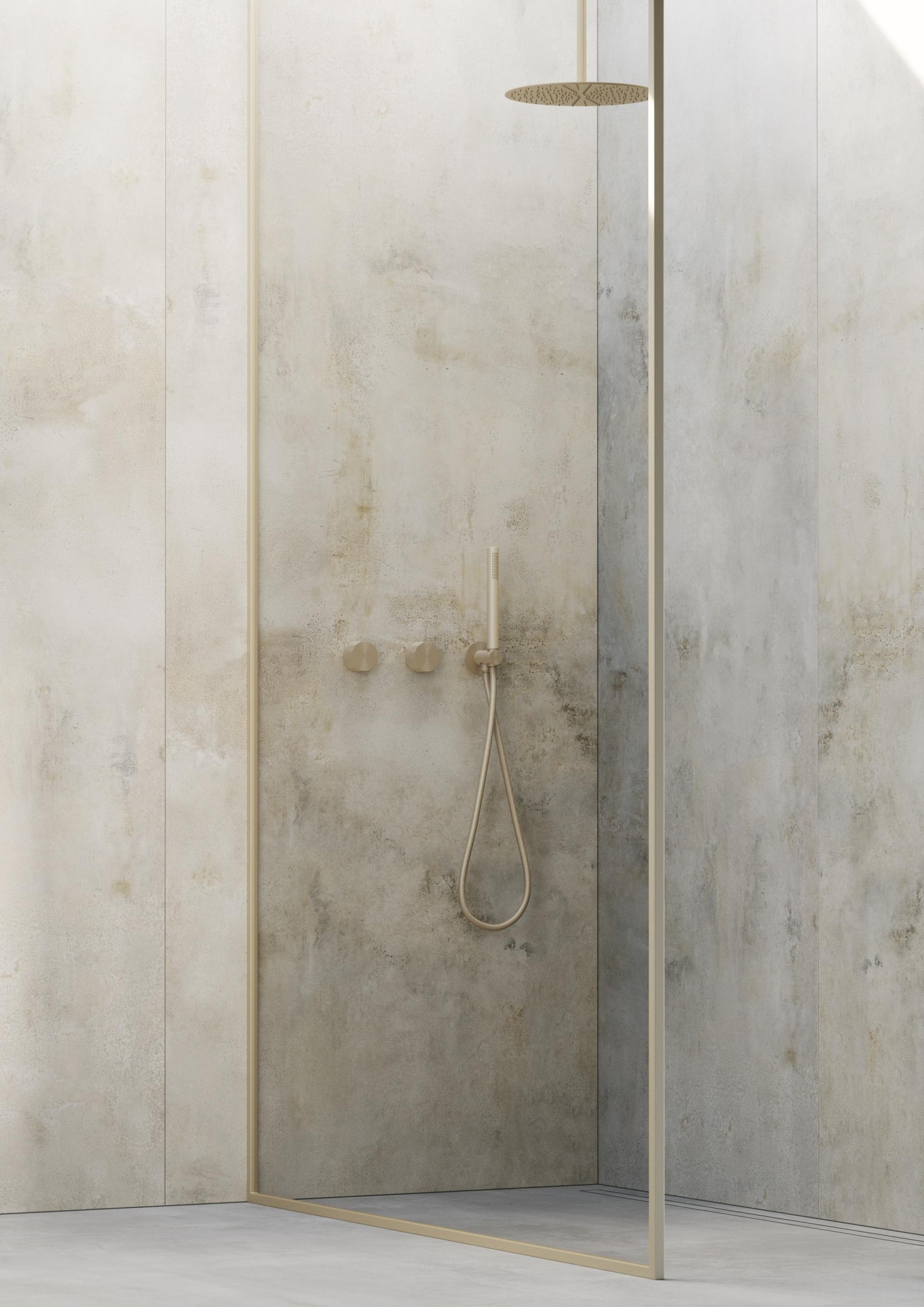 Sleek shower design featuring minimalist fixtures and a textured wall, showcasing Quadro Design Italy's innovative product range.