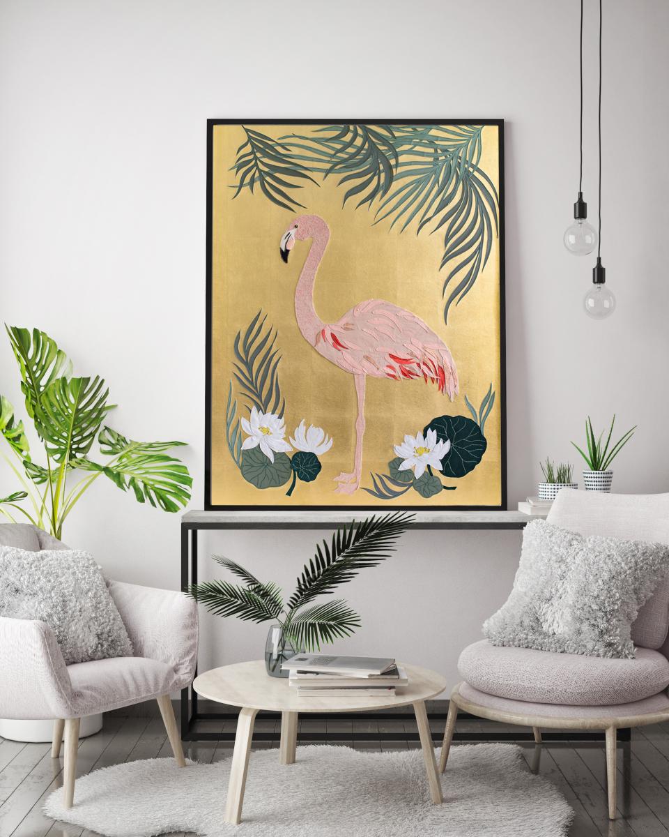 Stylish interior featuring a gold-colored flamingo artwork, surrounded by tropical plants and modern furnishings.