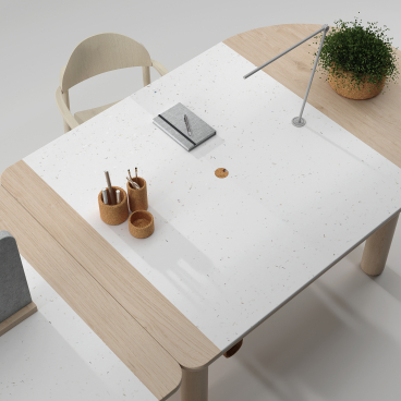Modern desk design with sustainable materials, featuring office supplies, a plant, and a stylish lamp for workspace efficiency.