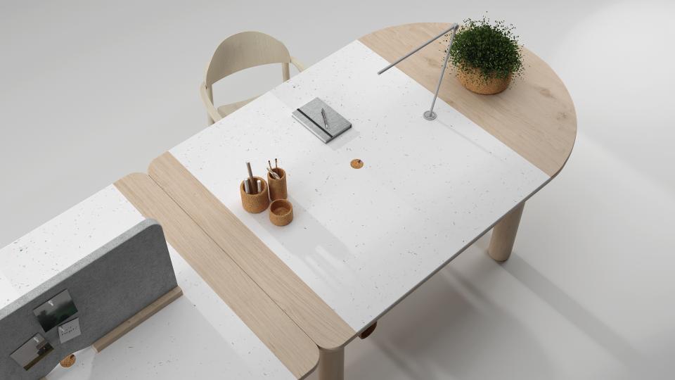 Modern desk design with sustainable materials, featuring office supplies, a plant, and a stylish lamp for workspace efficiency.