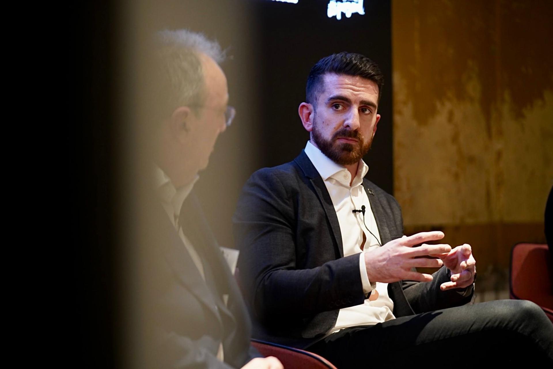 Panel discussion on sustainability featuring two speakers at Material Source Studio seminar.